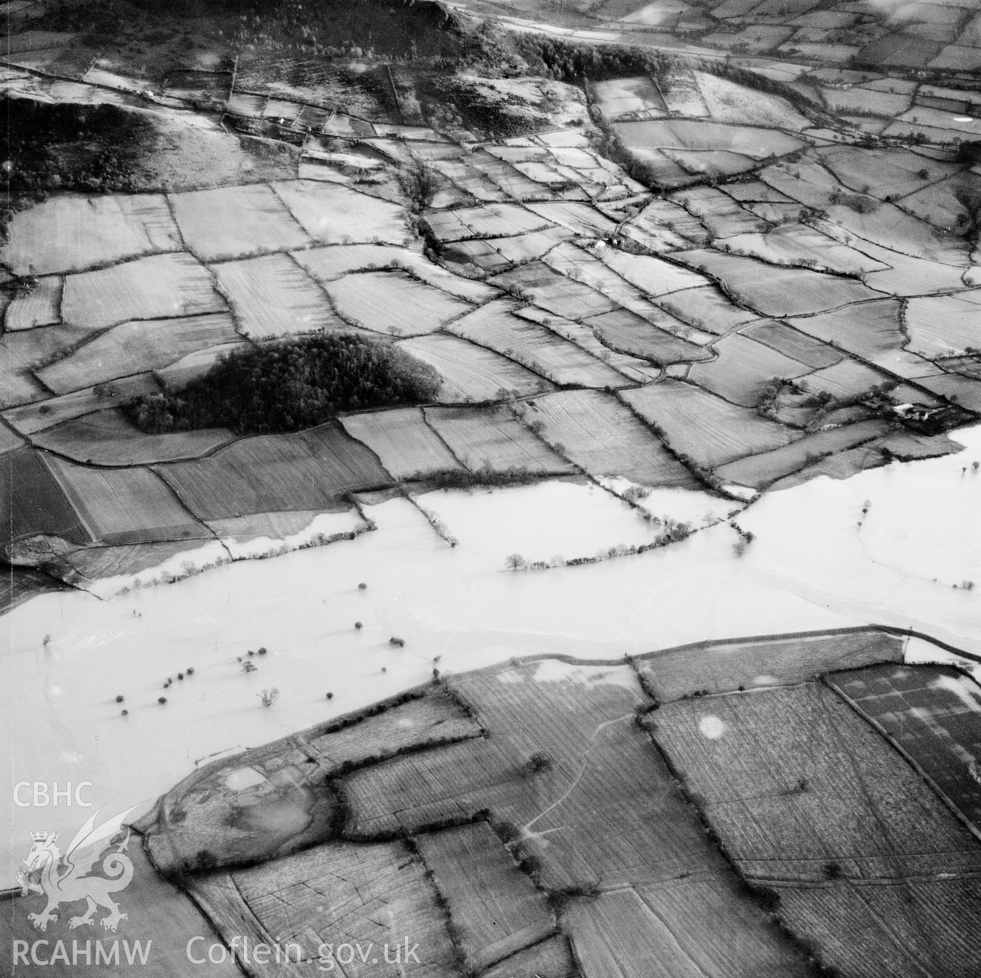 View of the river Severn in flood in the Criggion and Breiddan Hill area. Oblique aerial photograph, 5?" cut roll film.