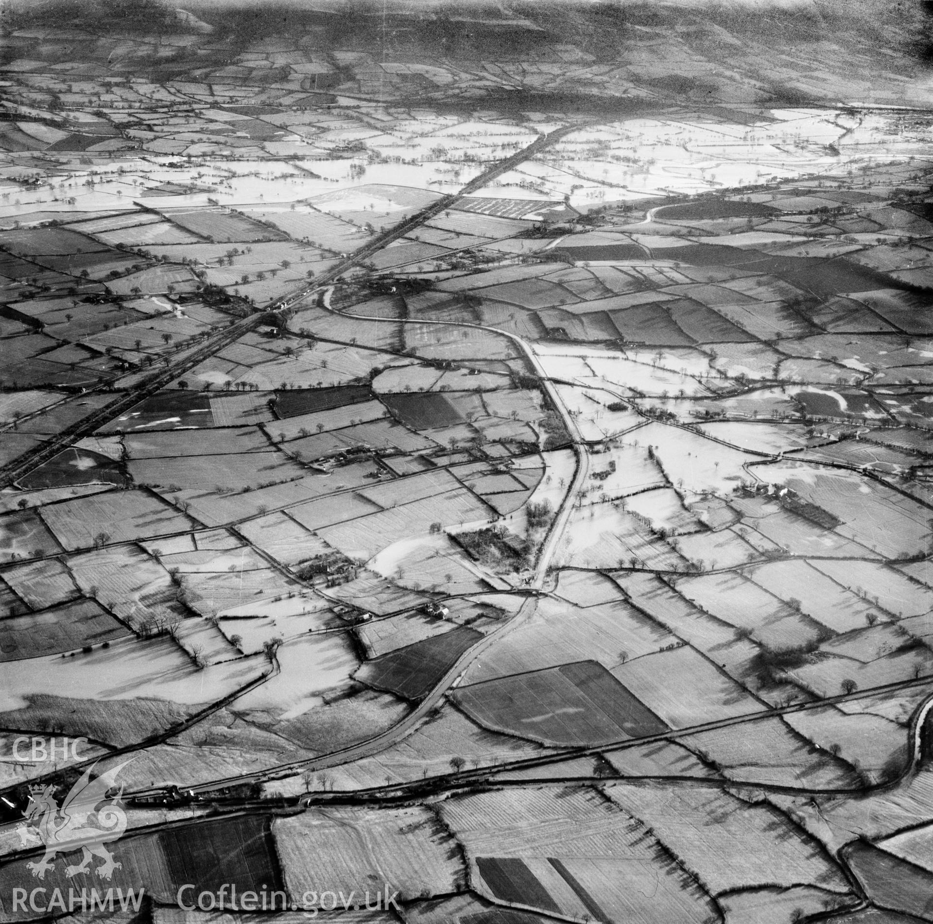 View of the river Severn in flood in the Criggion and Breiddan Hill area. Oblique aerial photograph, 5?" cut roll film.