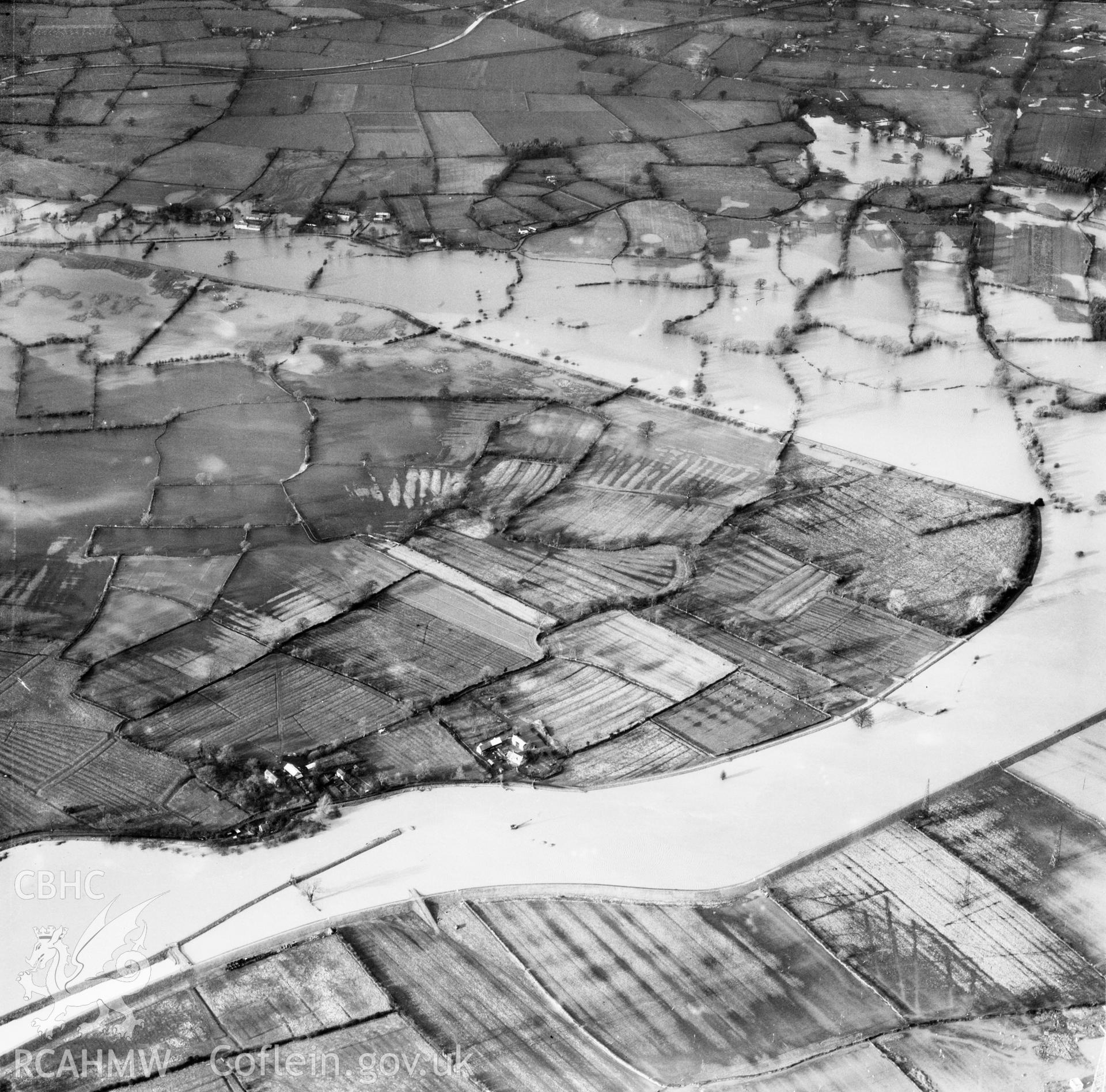 View of the river Severn in flood in the Criggion and Breiddan Hill area. Oblique aerial photograph, 5?" cut roll film.