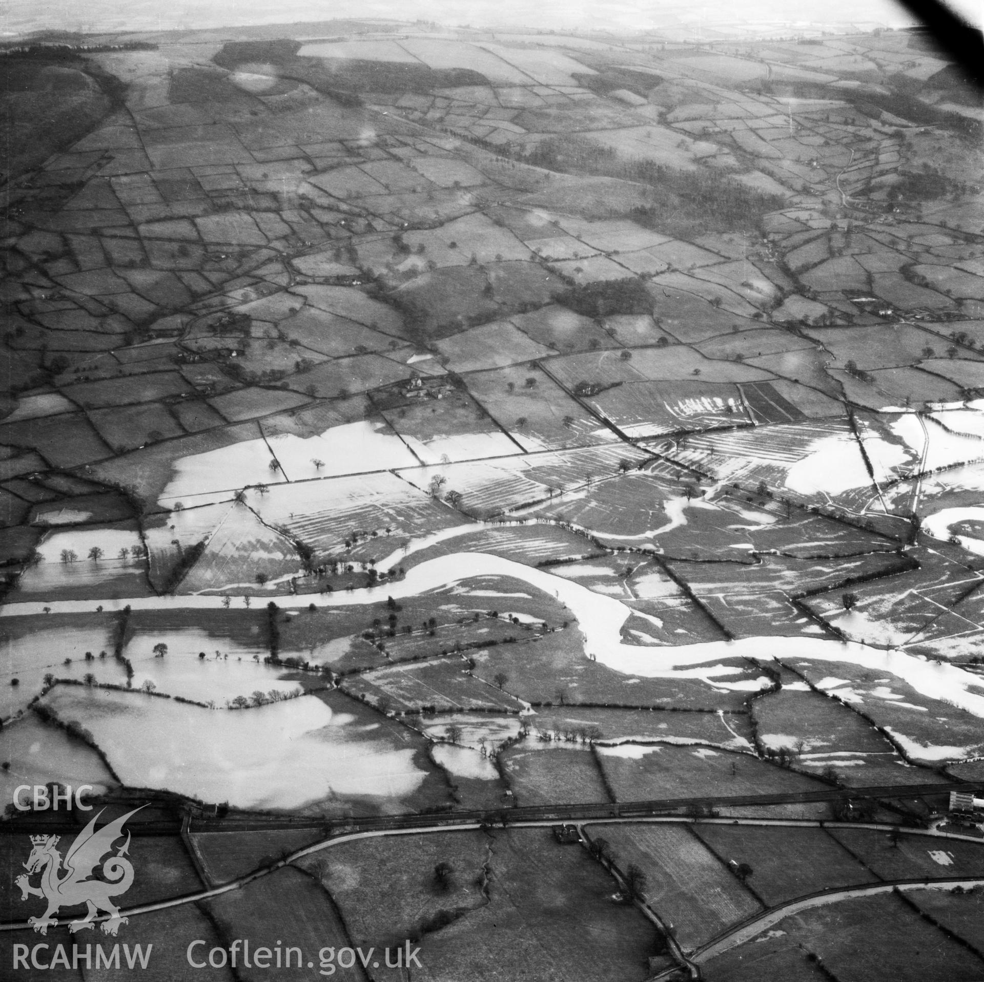 View of the river Severn in flood in the Criggion and Breiddan Hill area. Oblique aerial photograph, 5?" cut roll film.