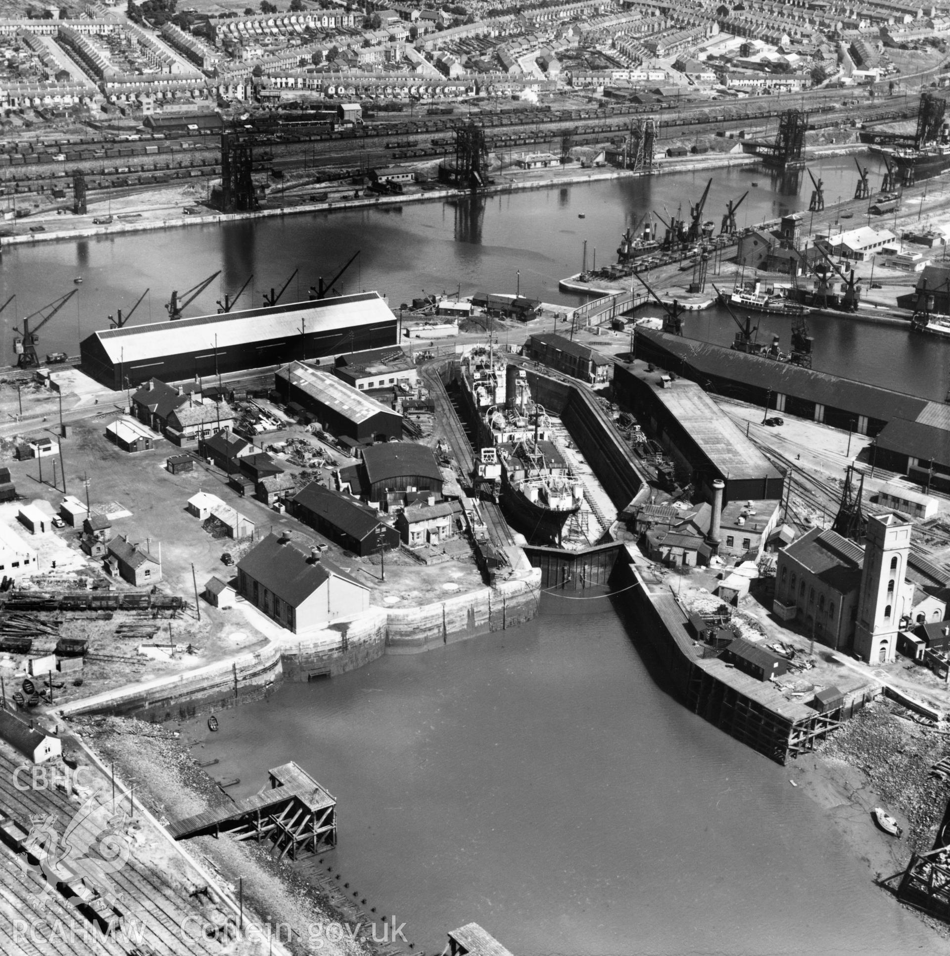 View of Prince of Wales dry dock, Swansea, showing the ship 'Pendeen' in dry dock. Oblique aerial photograph, 5?" cut roll film.
