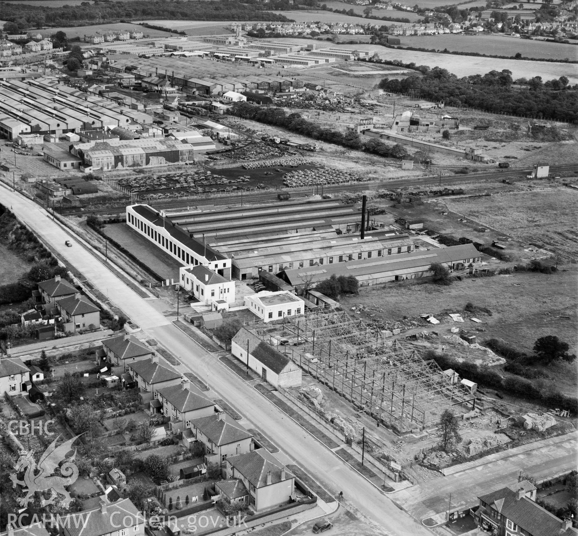 View of Morgan Rees & Sons Ltd. Whitchurch, showing redundant military armoured vehicles stored at the adjacent Royal Odnance Factory