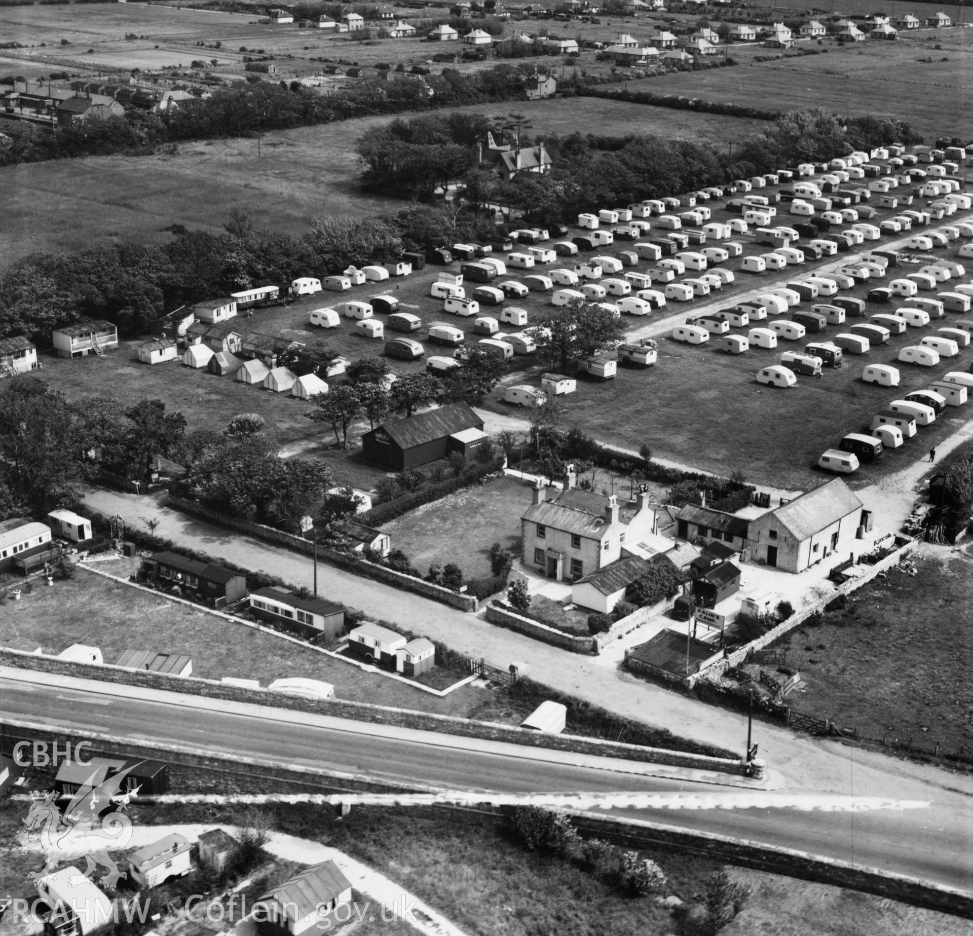 View of Palin's Holiday Camp, Foryd, commissioned by W.H.Smith & Son Ltd.. Oblique aerial photograph, 5?" cut roll film.