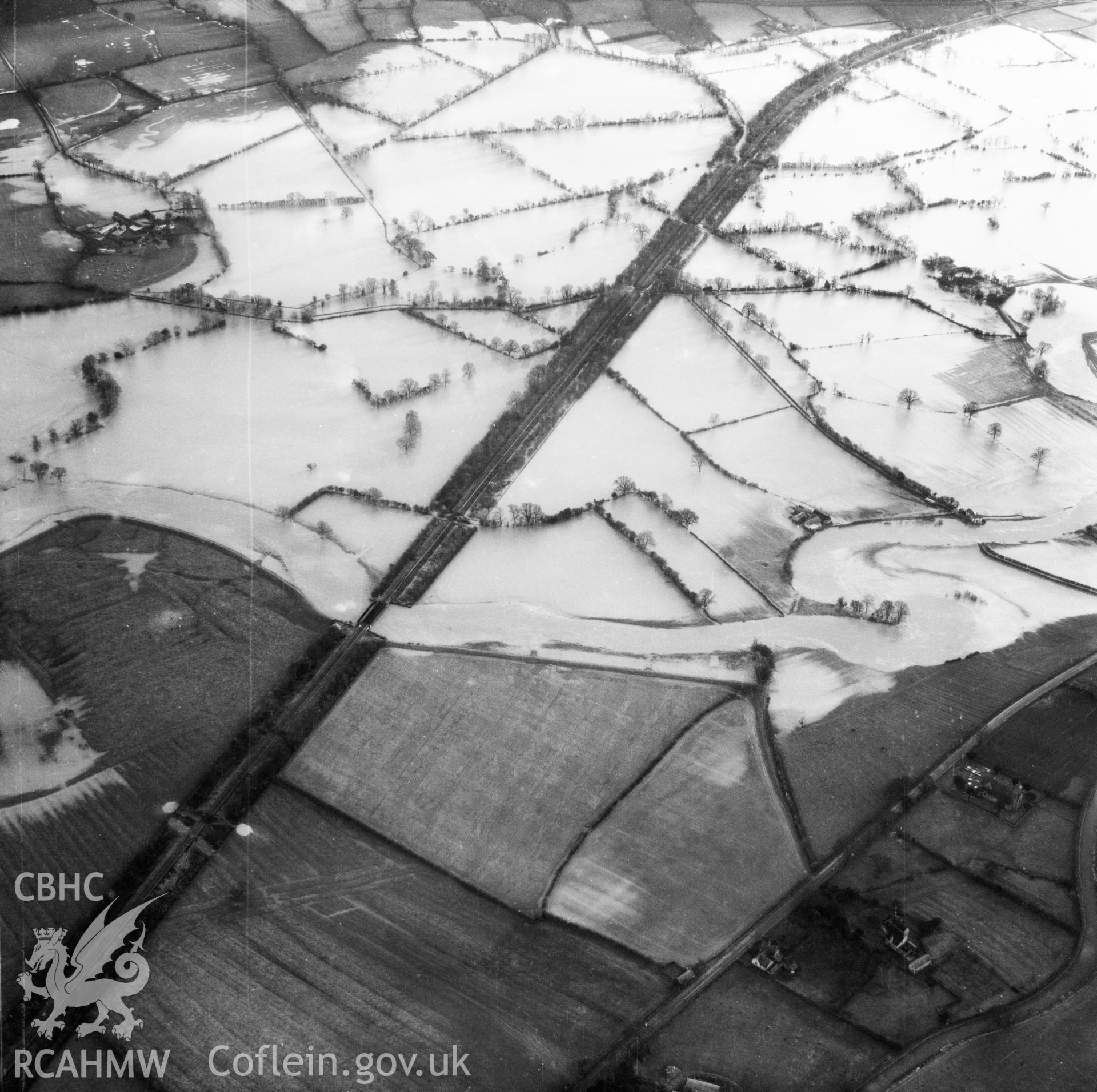 View of the river Severn in flood in the Criggion and Breiddan Hill area. Oblique aerial photograph, 5?" cut roll film.