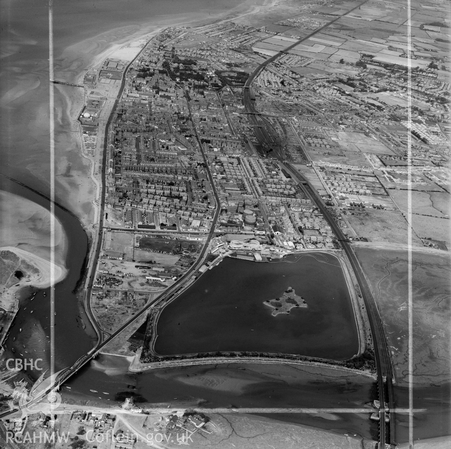 Distant view of Rhyl showing amusement park and Marine Lake, Rhyl (commissioned by Rhyl Amusements Ltd.)