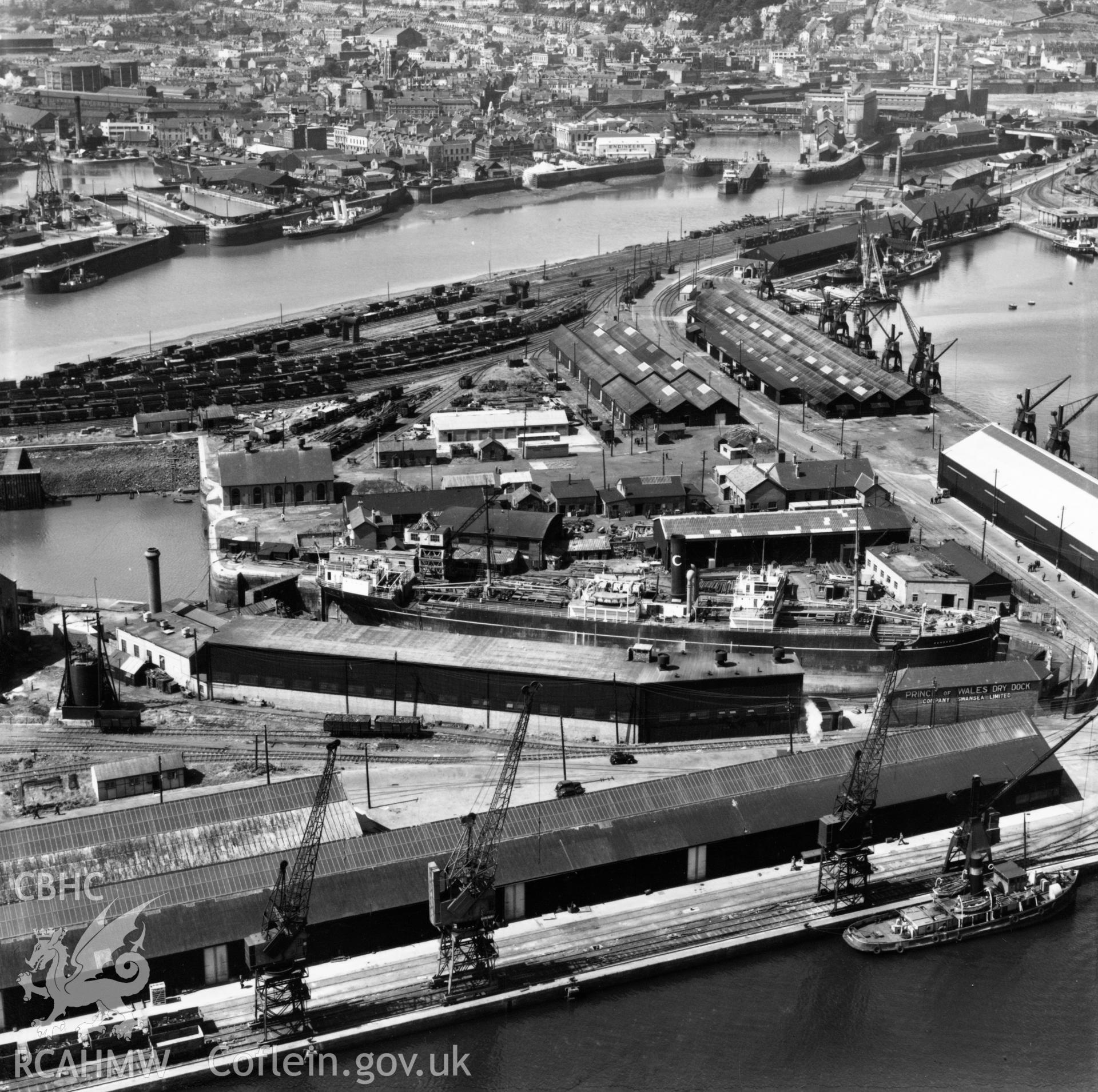 View of Prince of Wales dry dock, Swansea, showing the ship 'Pendeen' in dry dock. Oblique aerial photograph, 5?" cut roll film.