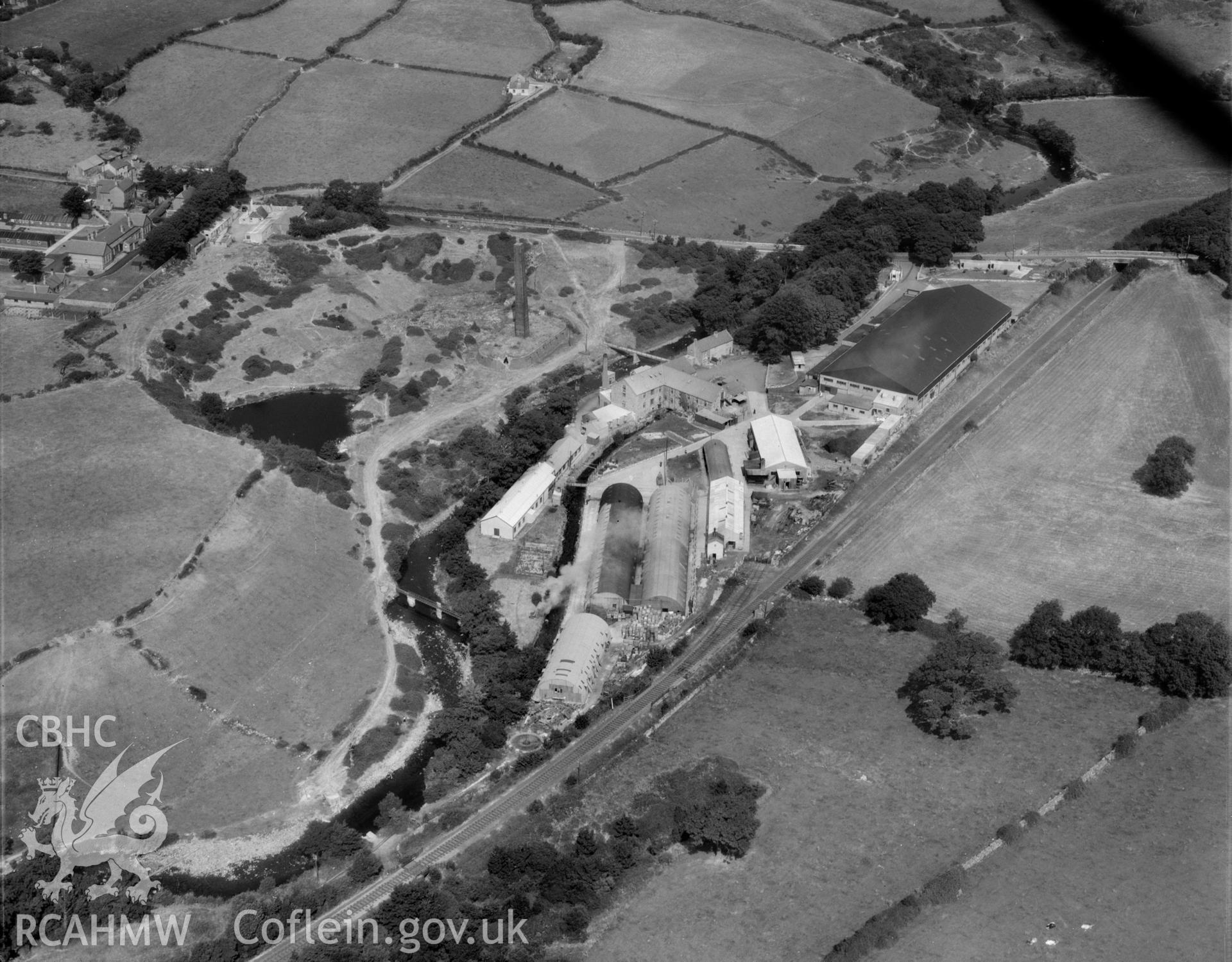 View of factory complex at Peblig Mill, Caernarfon, showing the mill, remains of brickworks, nissan huts and other works buildings