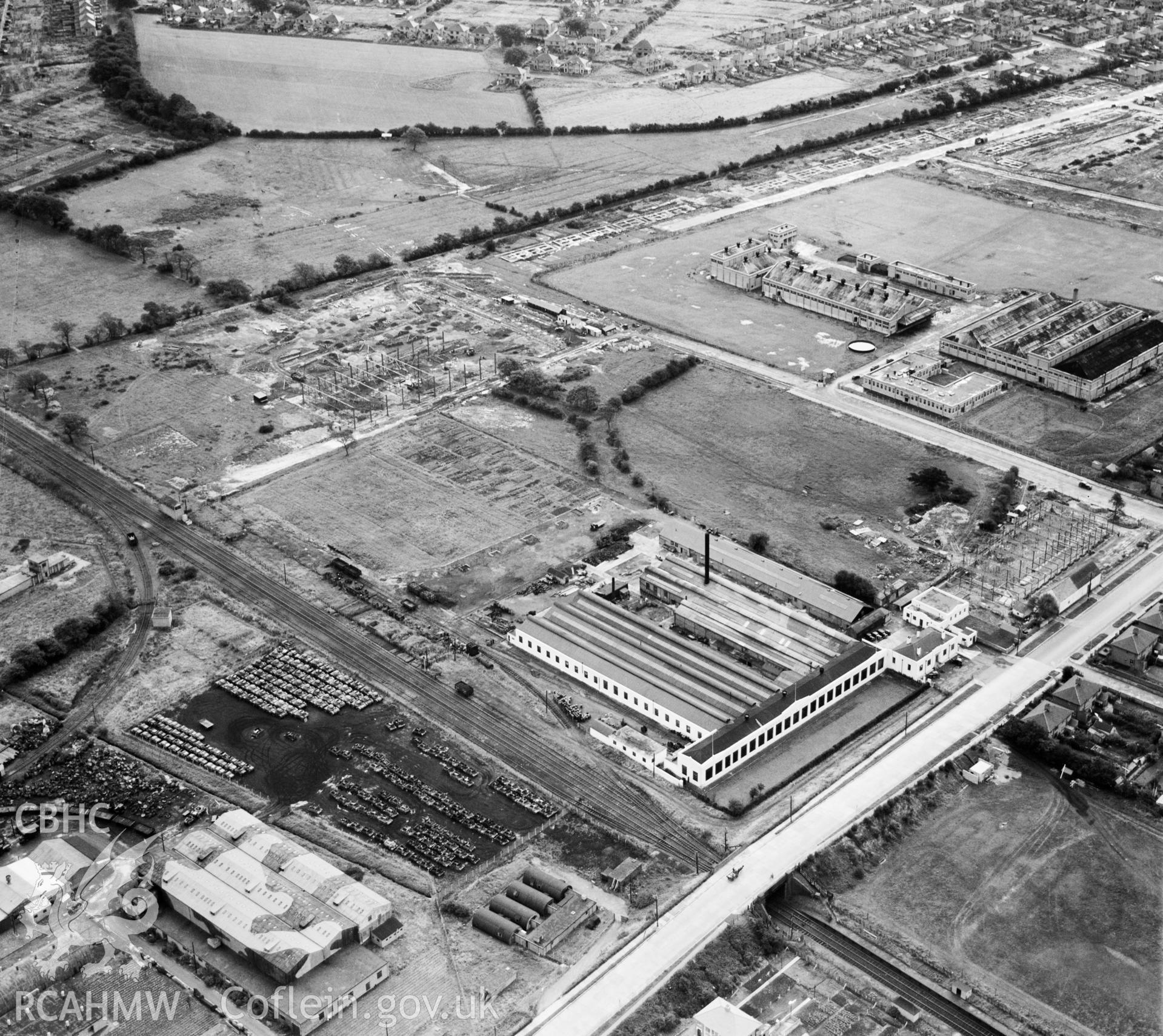 View of Morgan Rees & Sons Ltd. Whitchurch, showing redundant military armoured vehicles stored at the adjacent Royal Odnance Factory