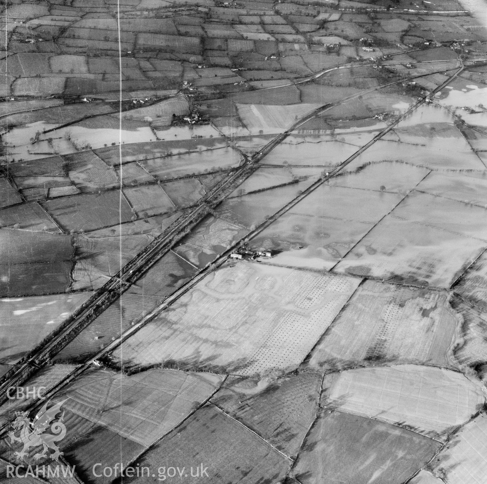 View of the river Severn in flood in the Criggion and Breiddan Hill area. Oblique aerial photograph, 5?" cut roll film.