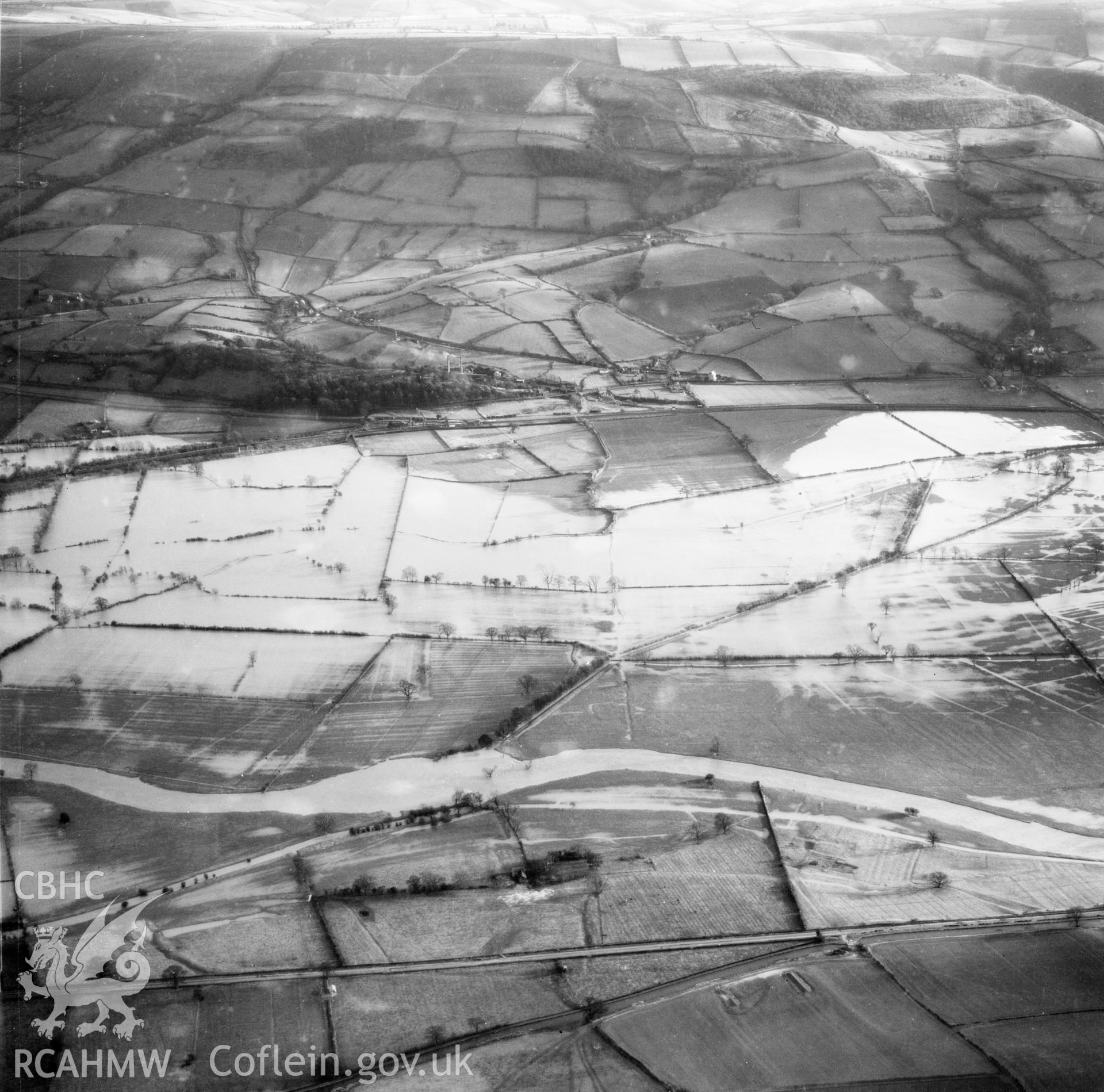 View of the river Severn in flood in the Criggion and Breiddan Hill area. Oblique aerial photograph, 5?" cut roll film.