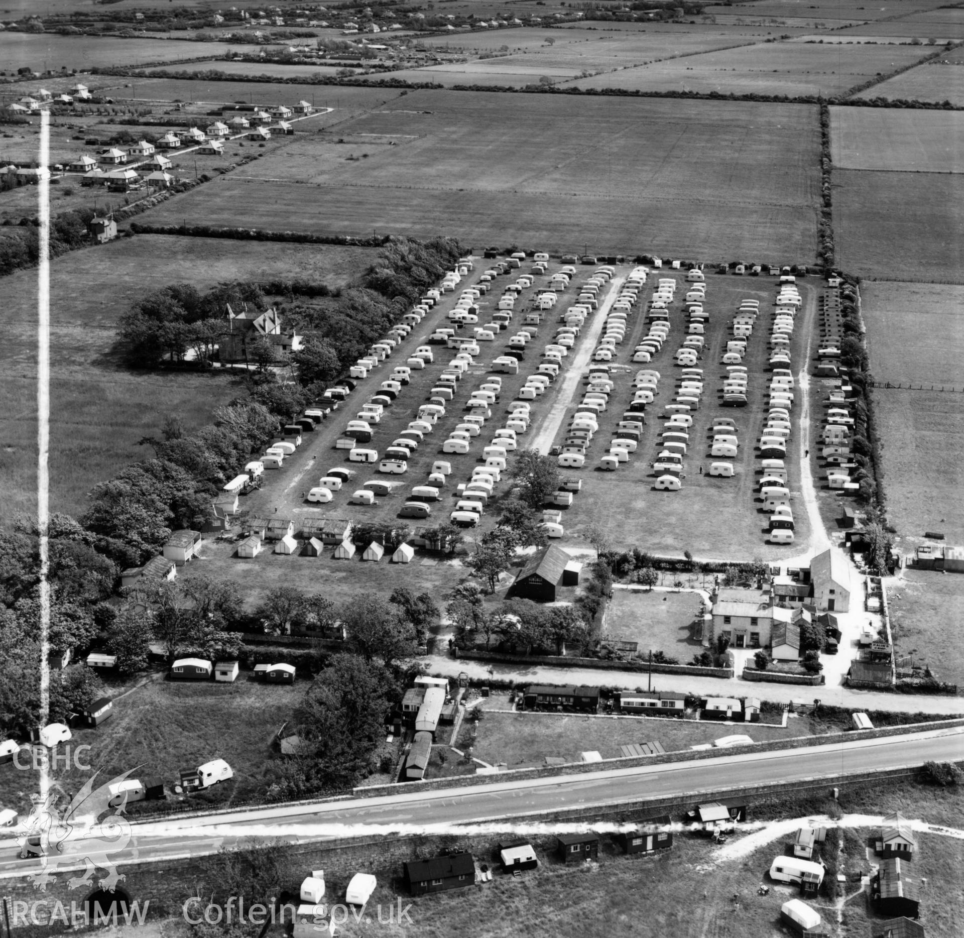 View of Palin's Holiday Camp, Foryd, commissioned by W.H.Smith & Son Ltd.. Oblique aerial photograph, 5?" cut roll film.