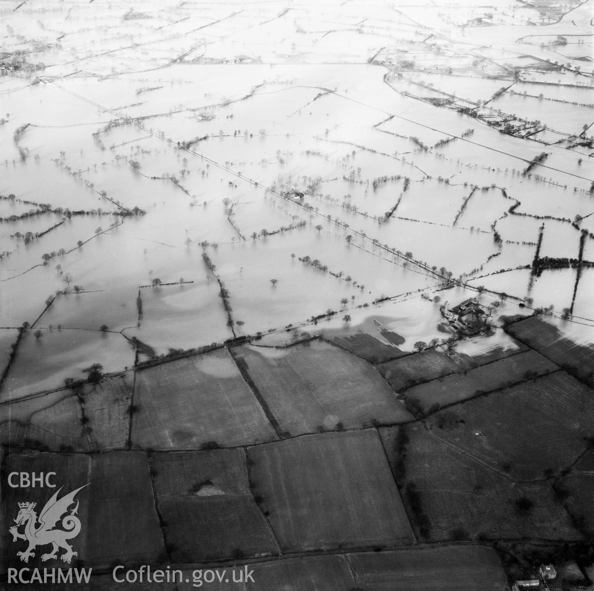 View of the river Severn in flood in the Criggion and Breiddan Hill area. Oblique aerial photograph, 5?" cut roll film.