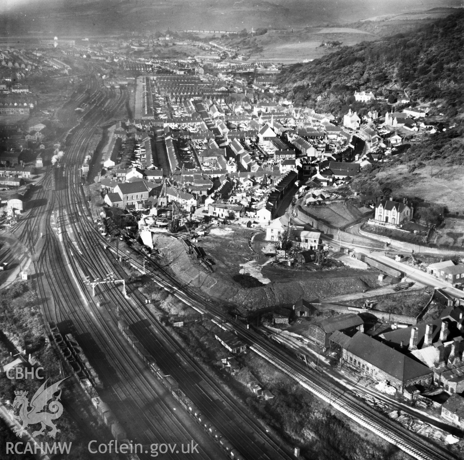 View of Briton Ferry and the Cleveland Bridge under construction. Oblique aerial photograph, 5?" cut roll film.