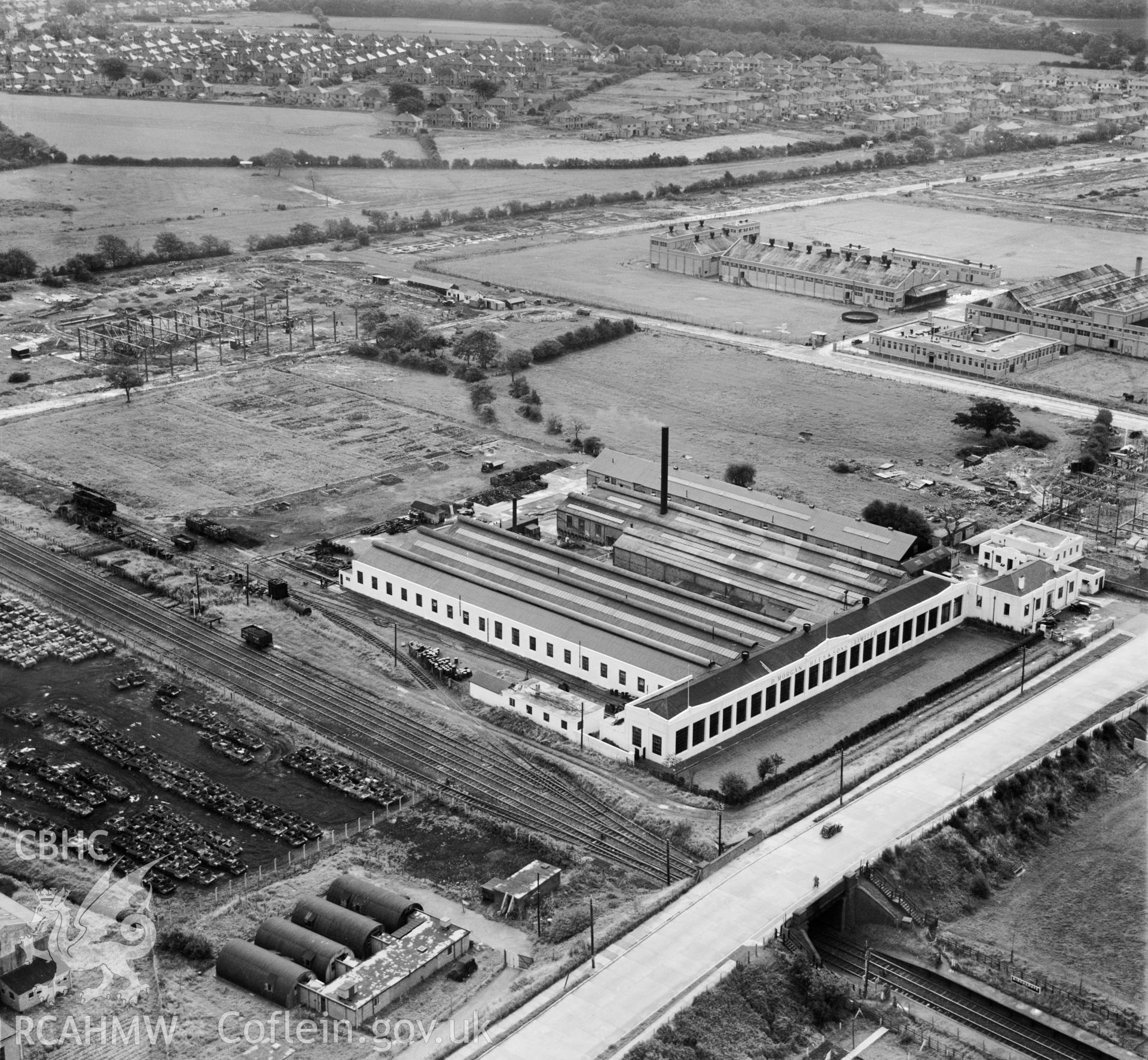 View of Morgan Rees & Sons Ltd. Whitchurch, showing redundant military armoured vehicles stored at the adjacent Royal Odnance Factory