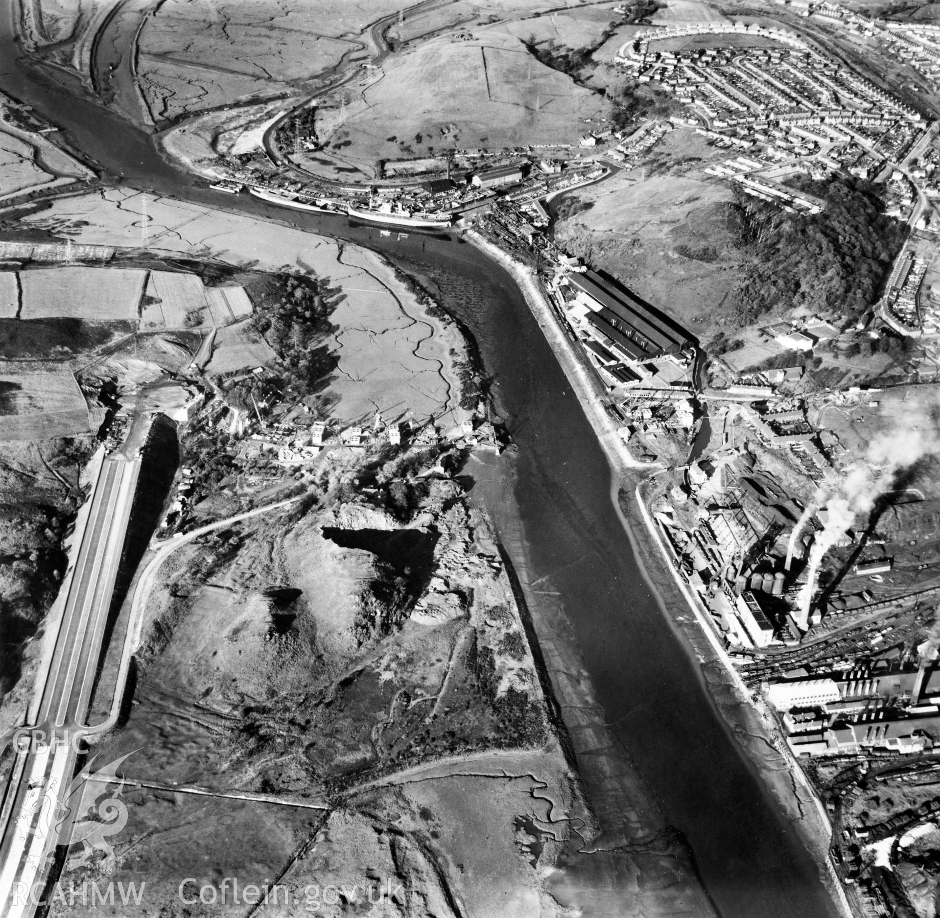 View of Briton Ferry and the Cleveland Bridge under construction. Oblique aerial photograph, 5?" cut roll film.