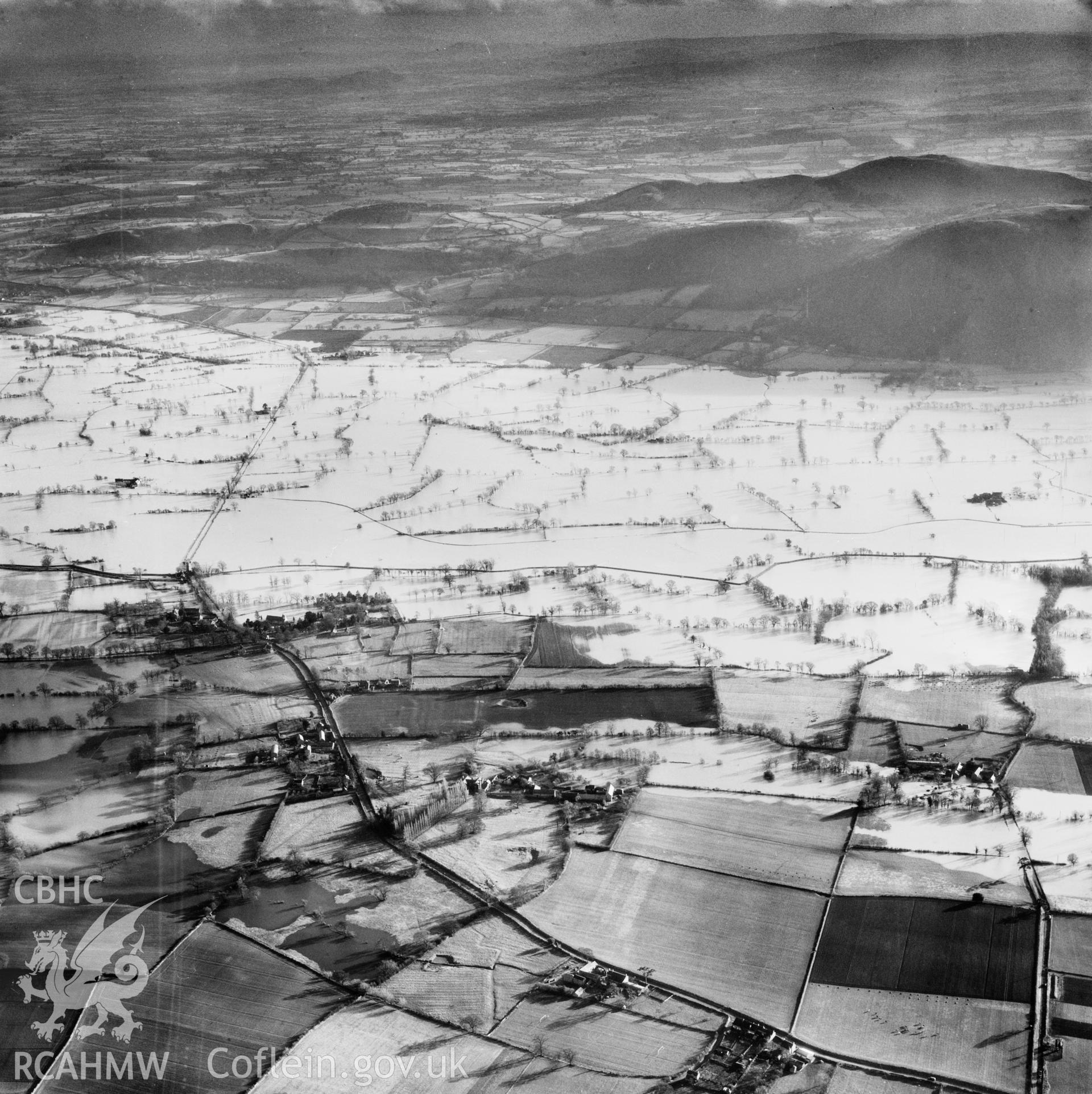 View of the river Severn in flood in the Criggion and Breiddan Hill area. Oblique aerial photograph, 5?" cut roll film.