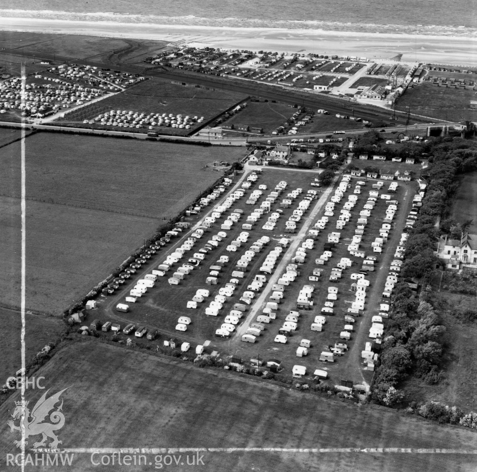 View of Palin's Holiday Camp, Foryd, commissioned by W.H.Smith & Son Ltd.. Oblique aerial photograph, 5?" cut roll film.