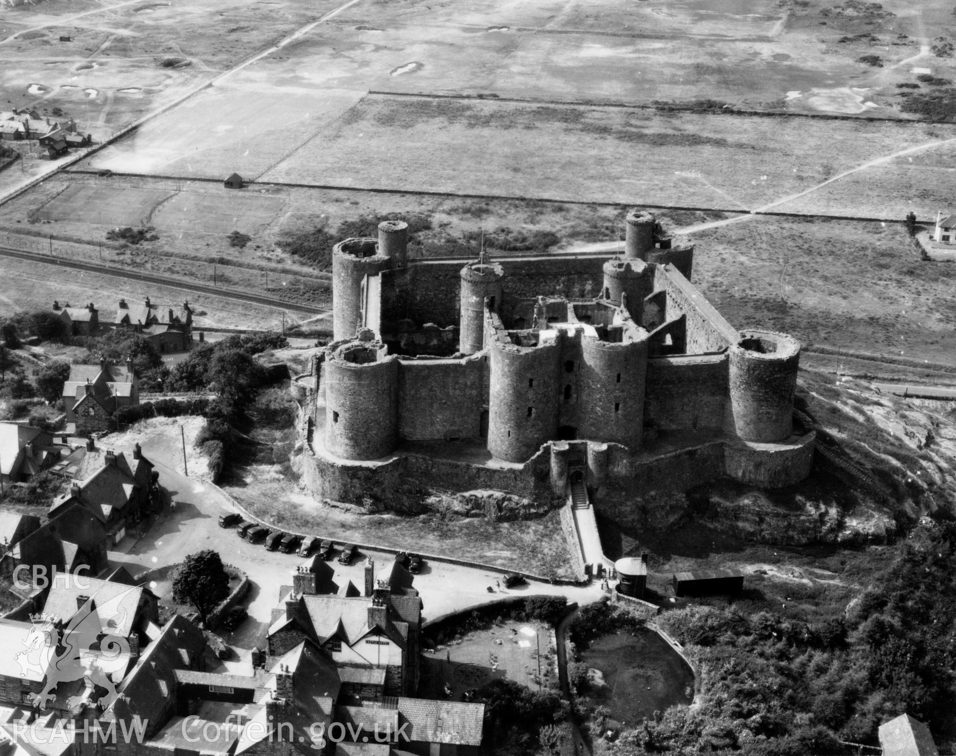 View of Harlech showing castle. Oblique aerial photograph, 5?" cut roll film.