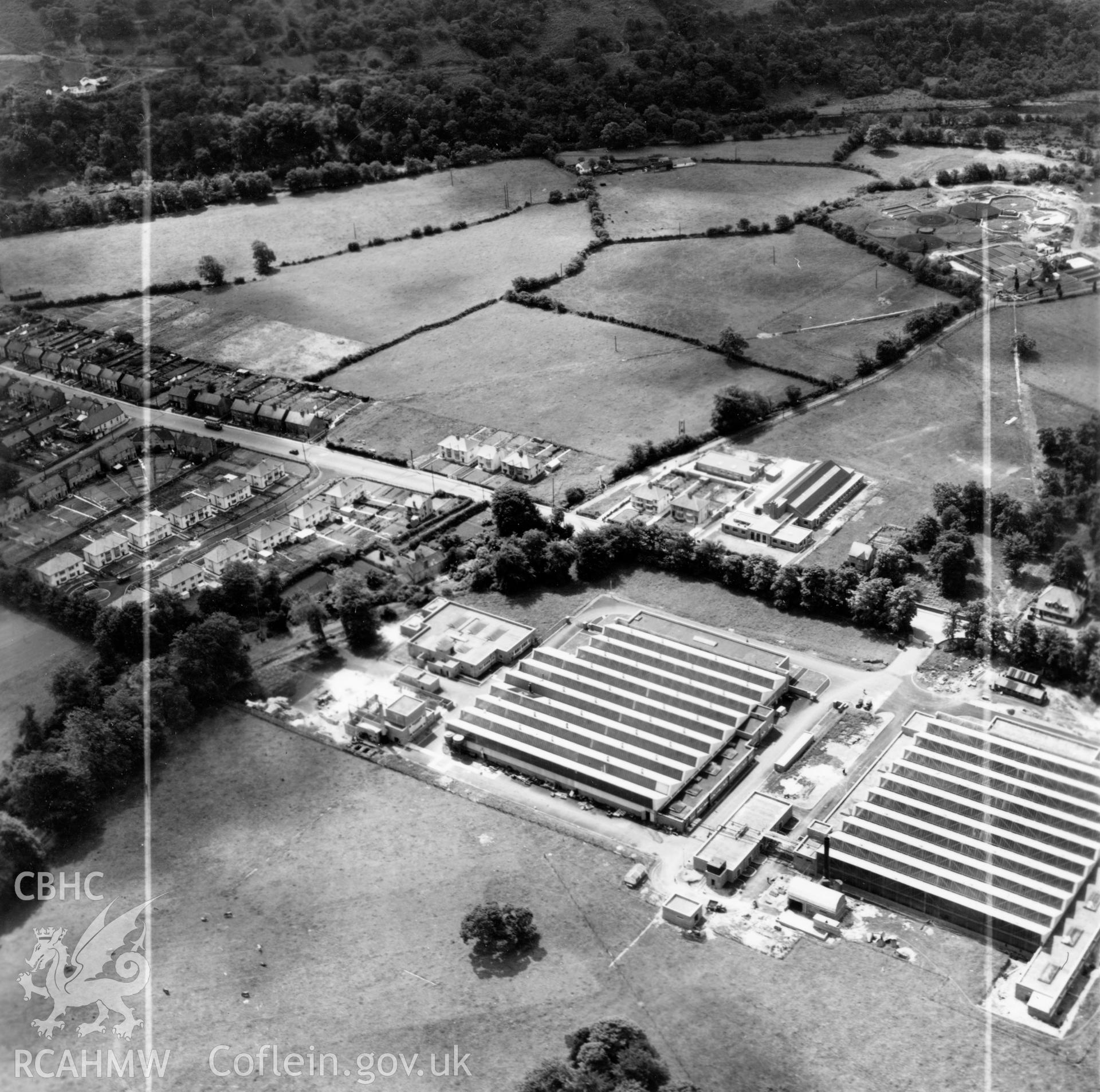 View of Smith's Clock and the Anglo-Welsh watch factories, Gurnos (commissioned by William Cowlin & Son Ltd.). Oblique aerial photograph, 5?" cut roll film.