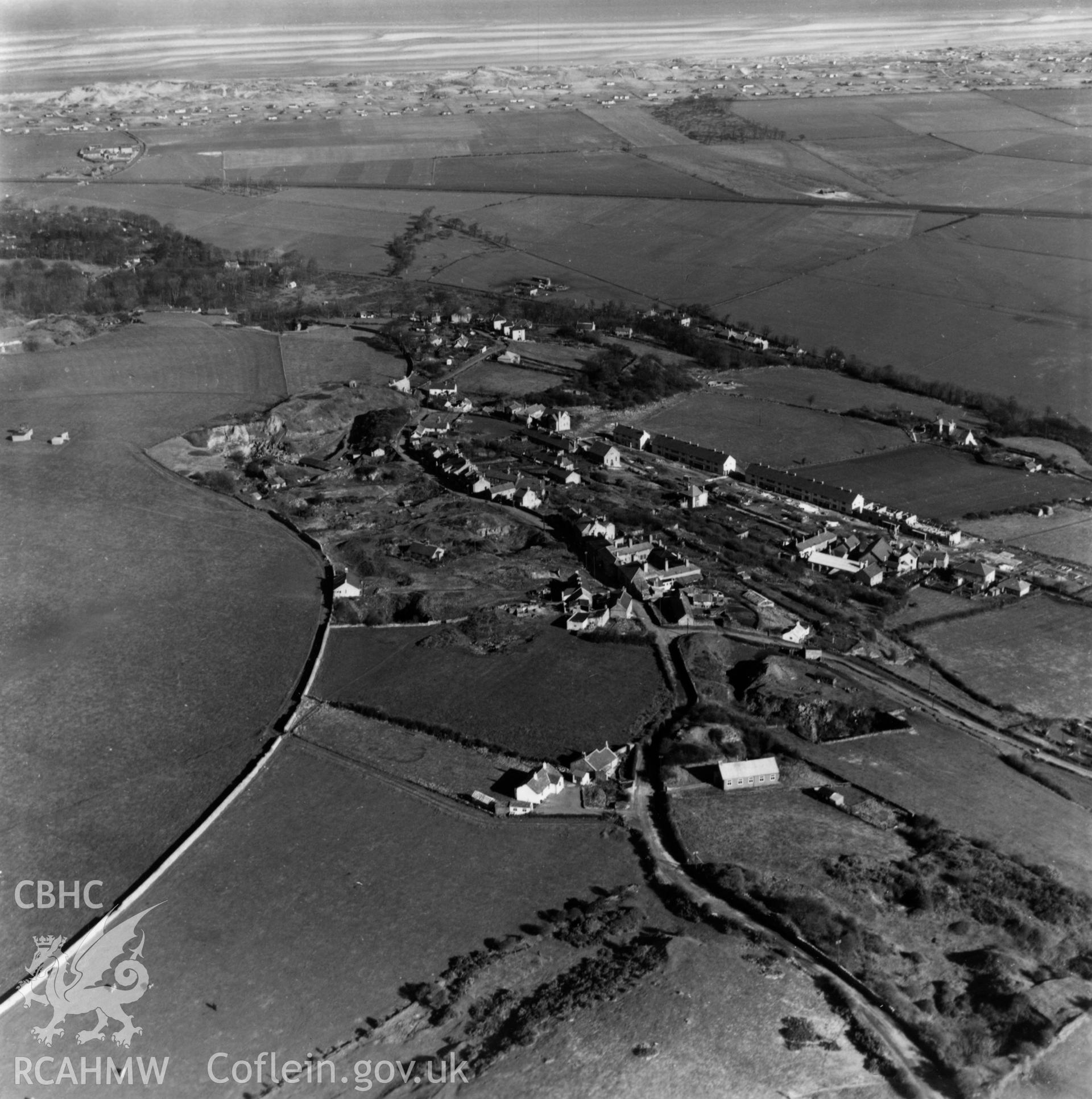 View of Gwespyr and the Chester & Holyhead railway with stone quarries to the left and Mission church in foreground. Oblique aerial photograph, 5?" cut roll film.