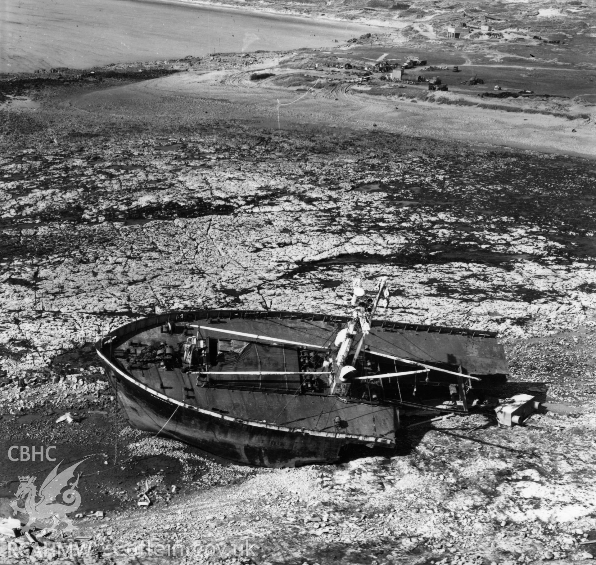 View of the wreck of SS Samtampa off Porthcawl. Oblique aerial photograph, 5?" cut roll film.