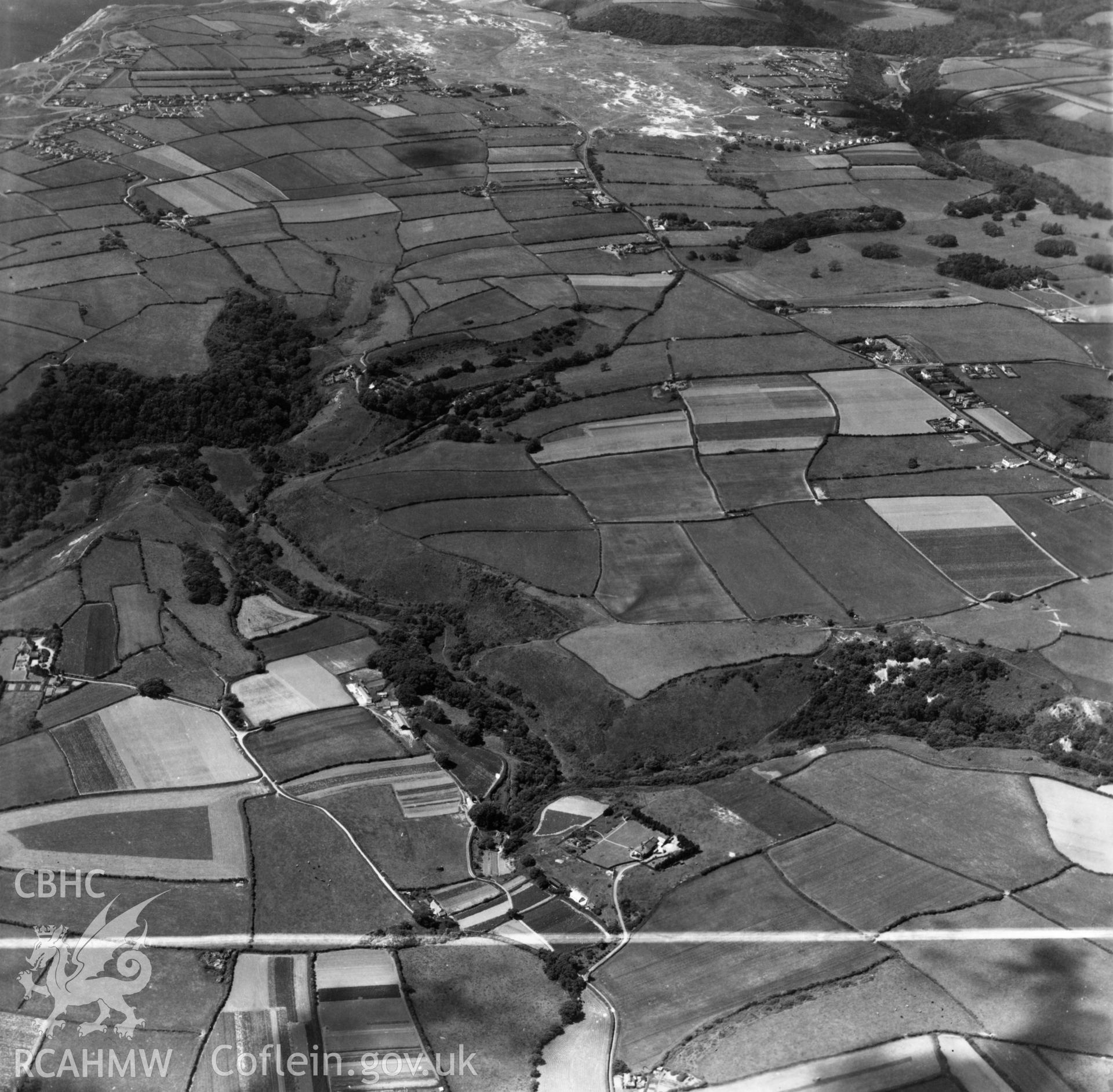 View down the Bishopston valley toward Pennard Burrows. Oblique aerial photograph, 5?" cut roll film.