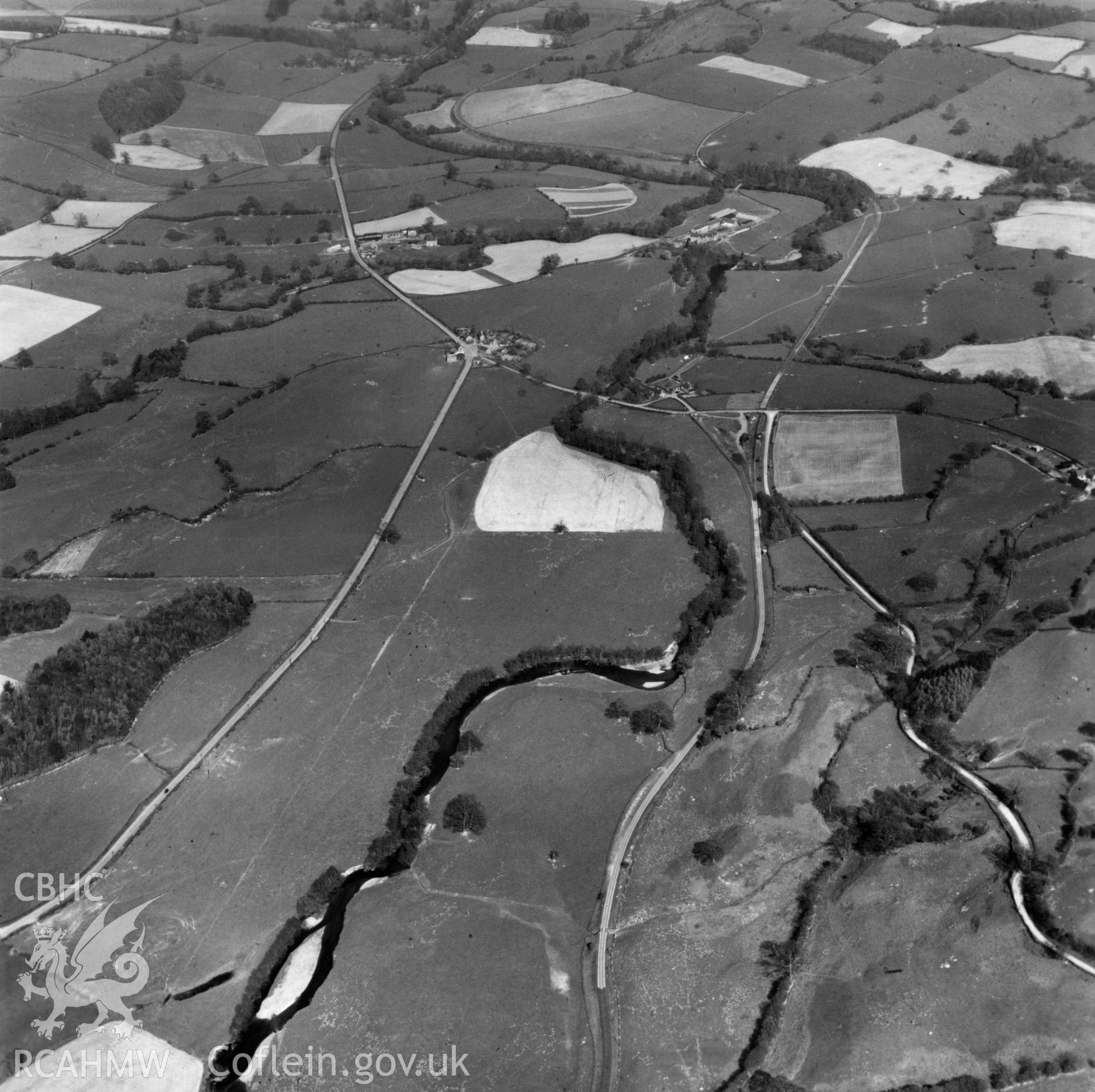 View of the Tanat valley showing railway and Pen-y-bont Llanerch Emrys. Oblique aerial photograph.