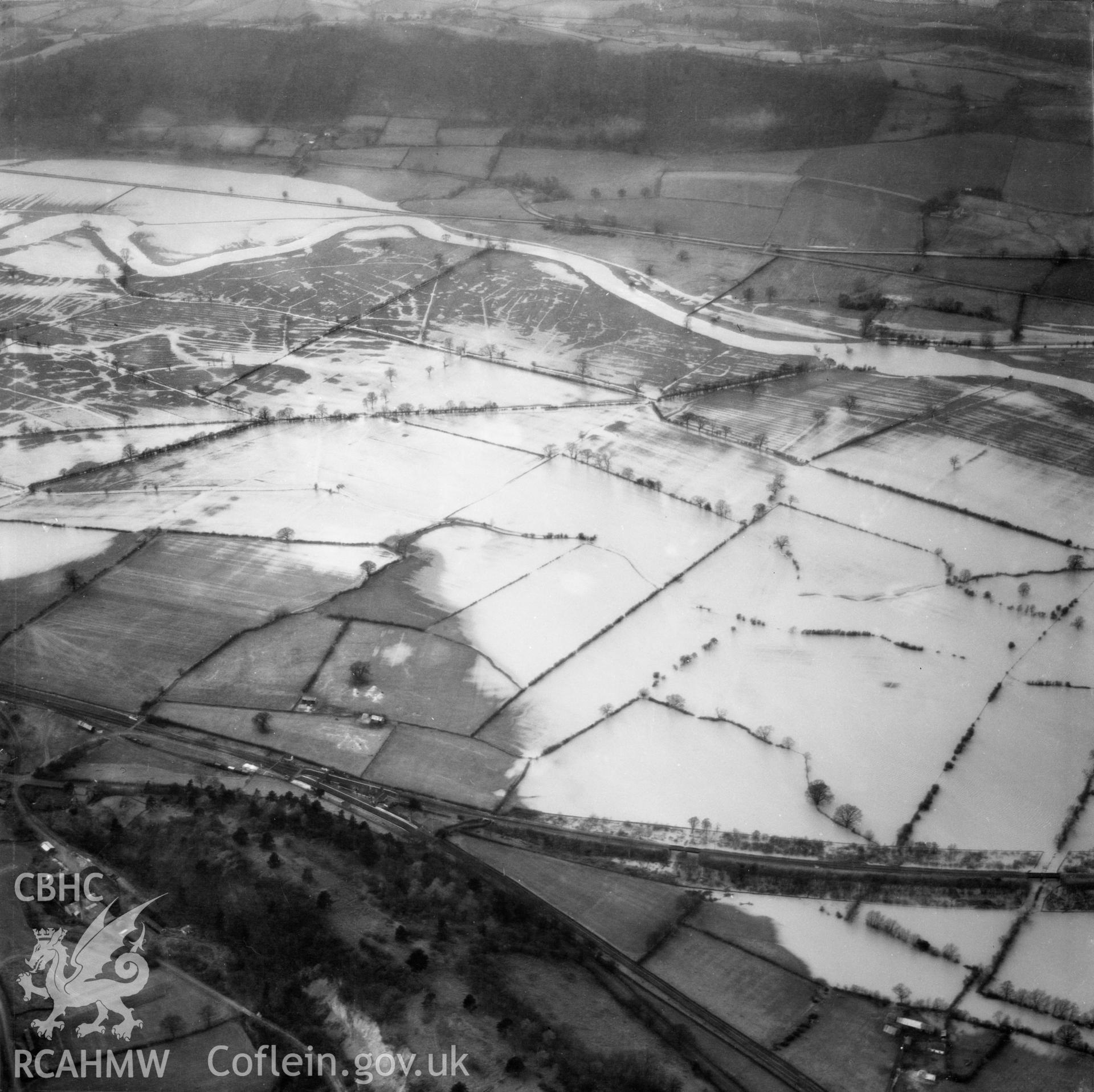 View of the river Severn in flood in the Criggion and Breiddan Hill area. Oblique aerial photograph, 5?" cut roll film.