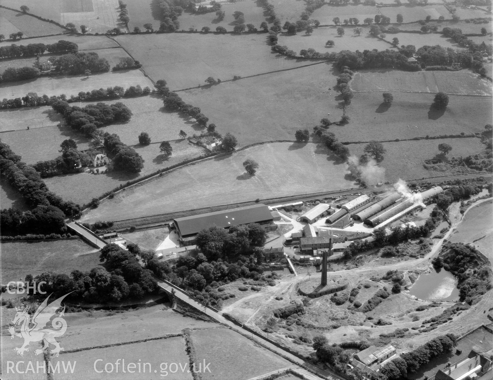 View of factory complex at Peblig Mill, Caernarfon, showing the mill, remains of brickworks, nissan huts and other works buildings