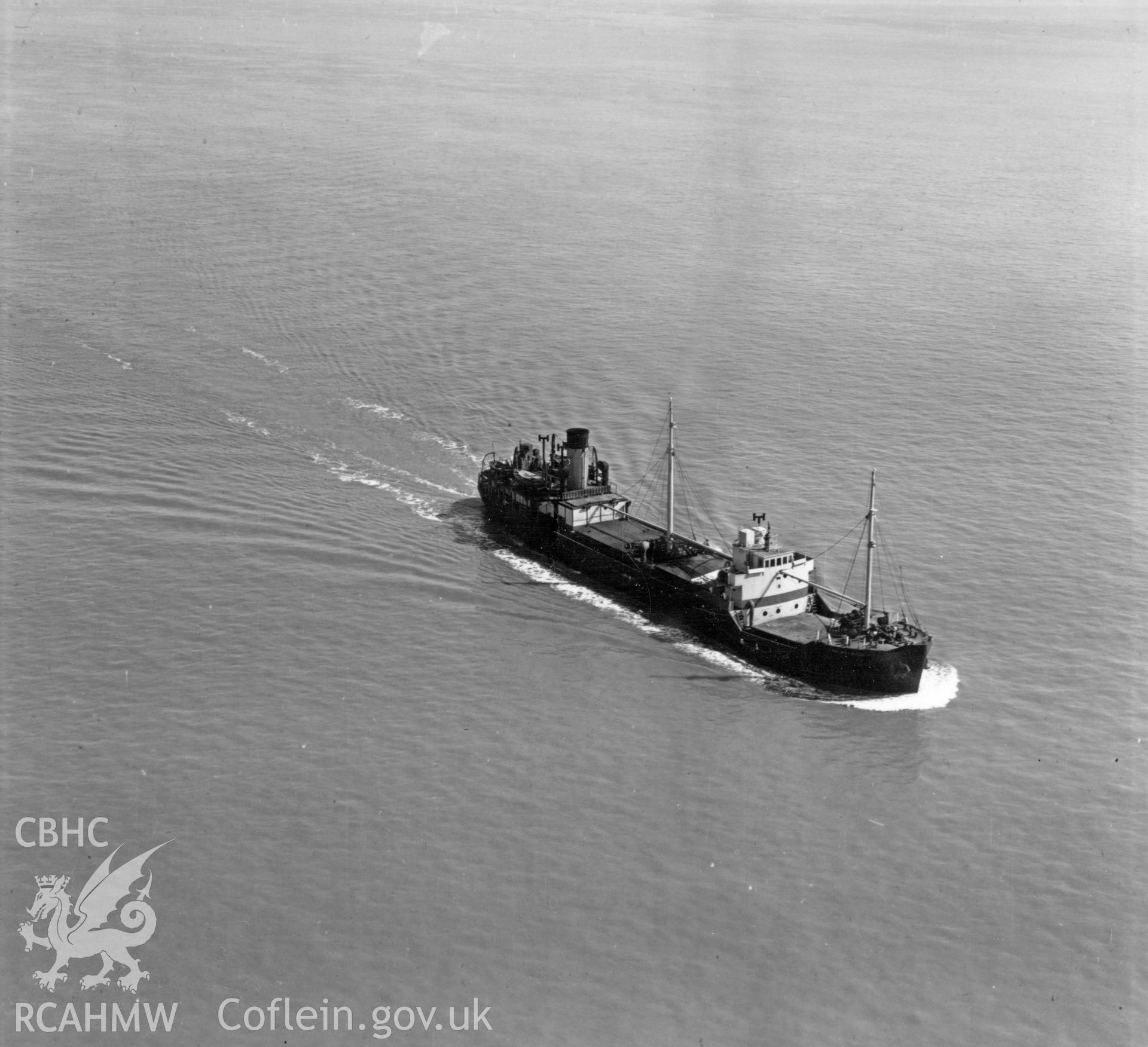 Close view of cargo ship in the Bristol Channel (Monarch). Oblique aerial photograph, 5?" cut roll film.