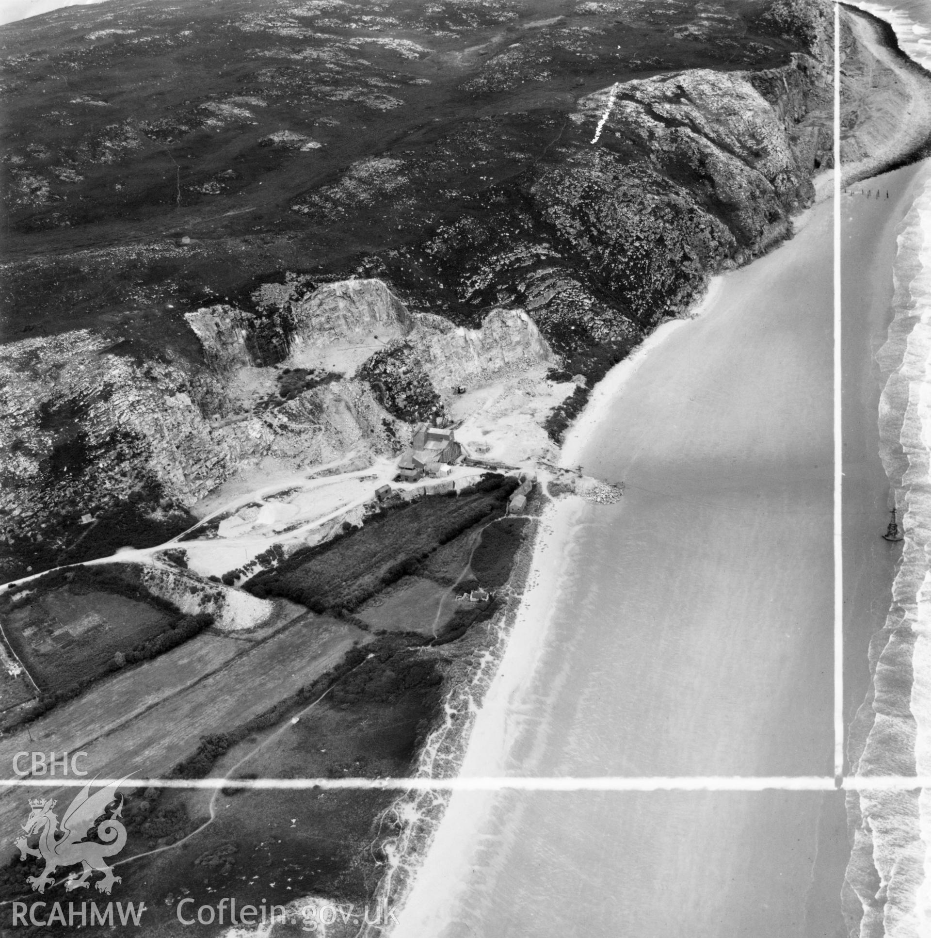 View of Llanbedrog quarry, showing aerial ropeway and remains of original quay, commissioned by Cawood Wharton & Co. Ltd.. Oblique aerial photograph, 5?" cut roll film.