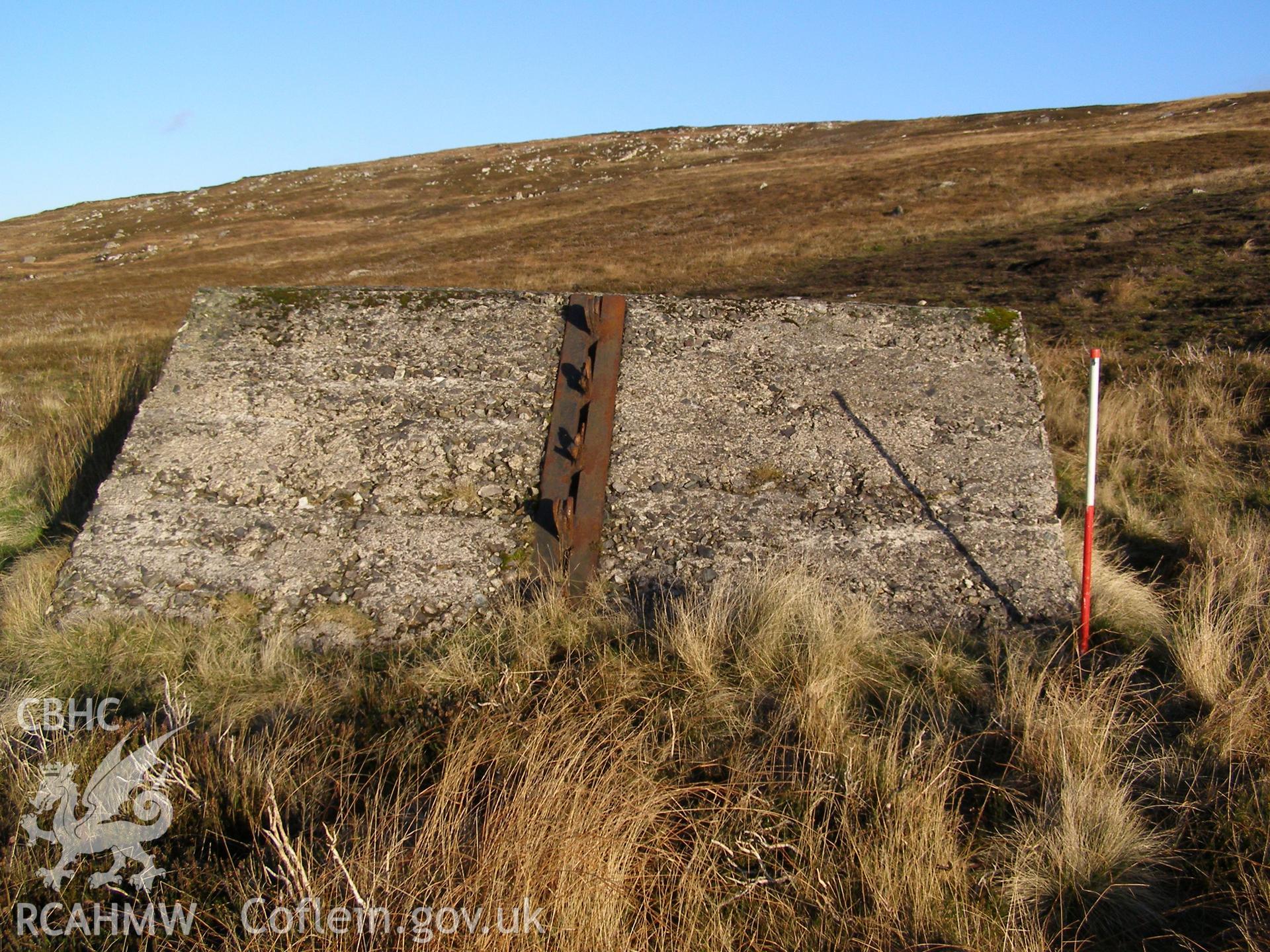 Digital colour photograph of Cefn Du Radio Station, concrete base XXXVIII taken on 10/12/2007 by P.J. Schofield during the Snowdon North West Upland Survey undertaken by Oxford Archaeology North.