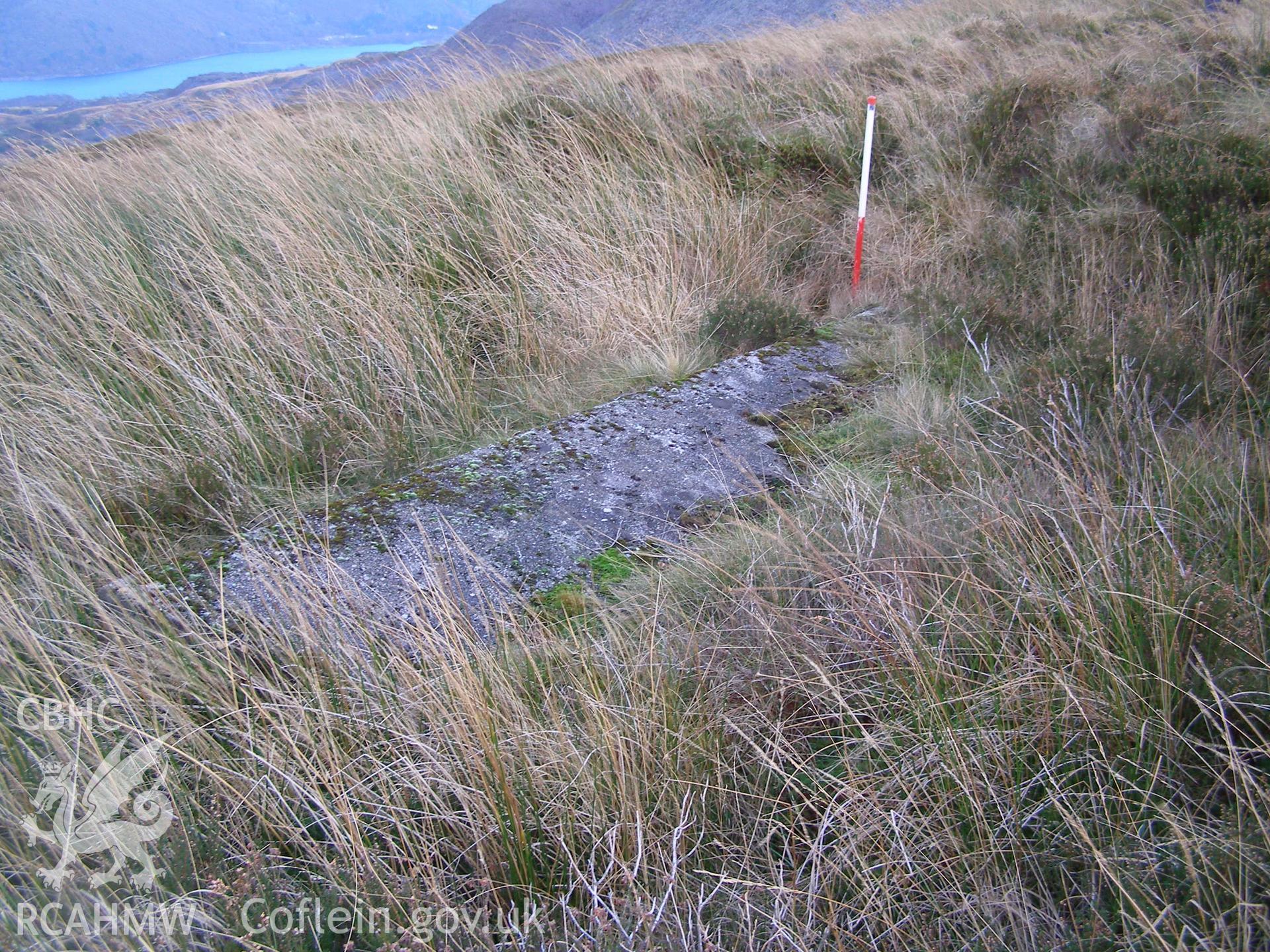 Digital colour photograph of Cefn Du Radio Station, concrete base LXV taken on 13/12/2007 by P.J. Schofield during the Snowdon North West Upland Survey undertaken by Oxford Archaeology North.