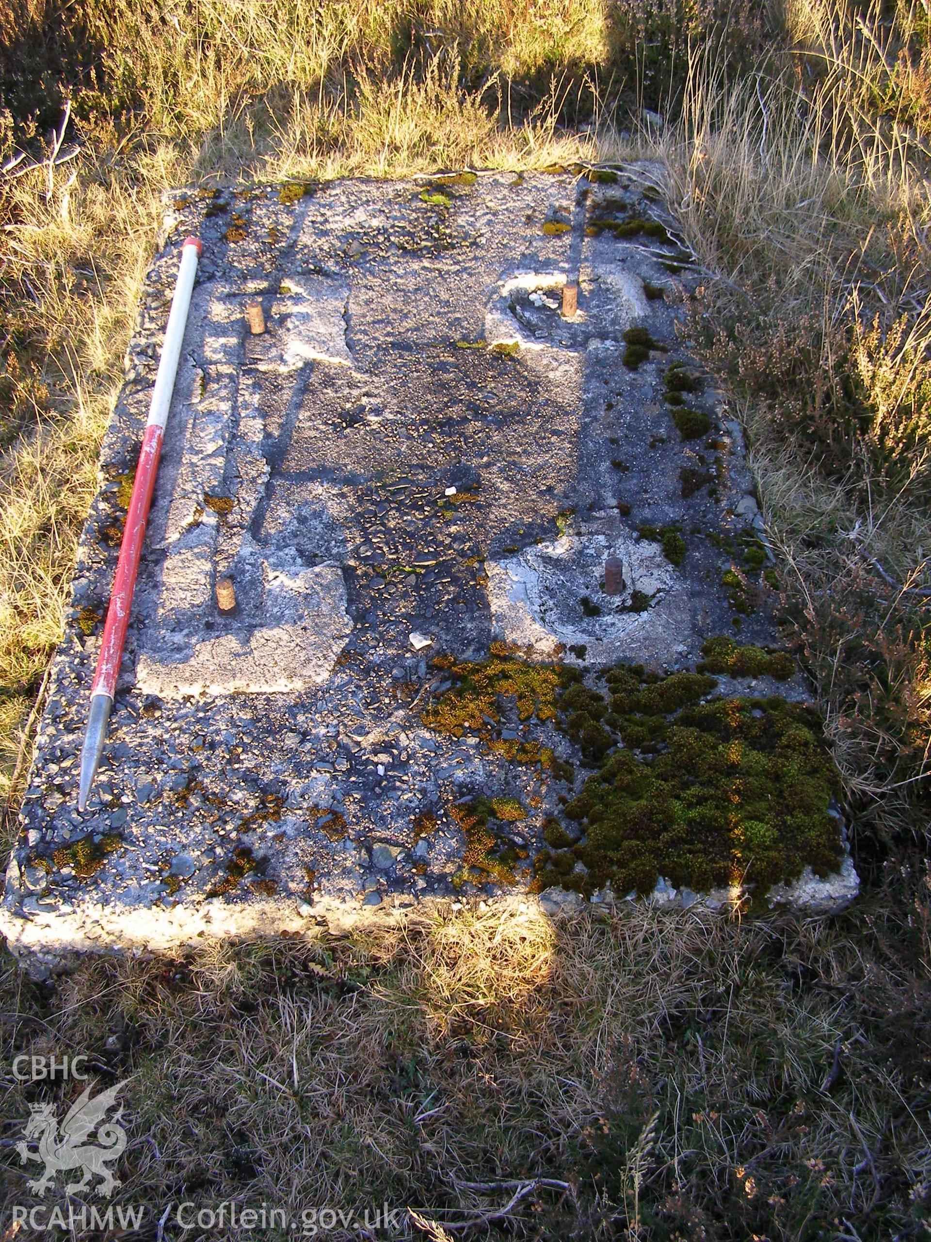 Digital colour photograph of Cefn Du Radio Station, concrete base LVI taken on 10/12/2007 by P.J. Schofield during the Snowdon North West Upland Survey undertaken by Oxford Archaeology North.