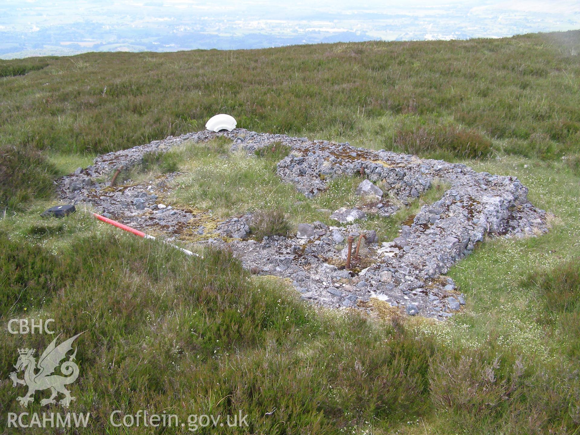 Digital colour photograph of Cefn Du Radio Station, concrete base II taken on 07/06/2007 by P.J. Schofield during the Snowdon North West Upland Survey undertaken by Oxford Archaeology North.