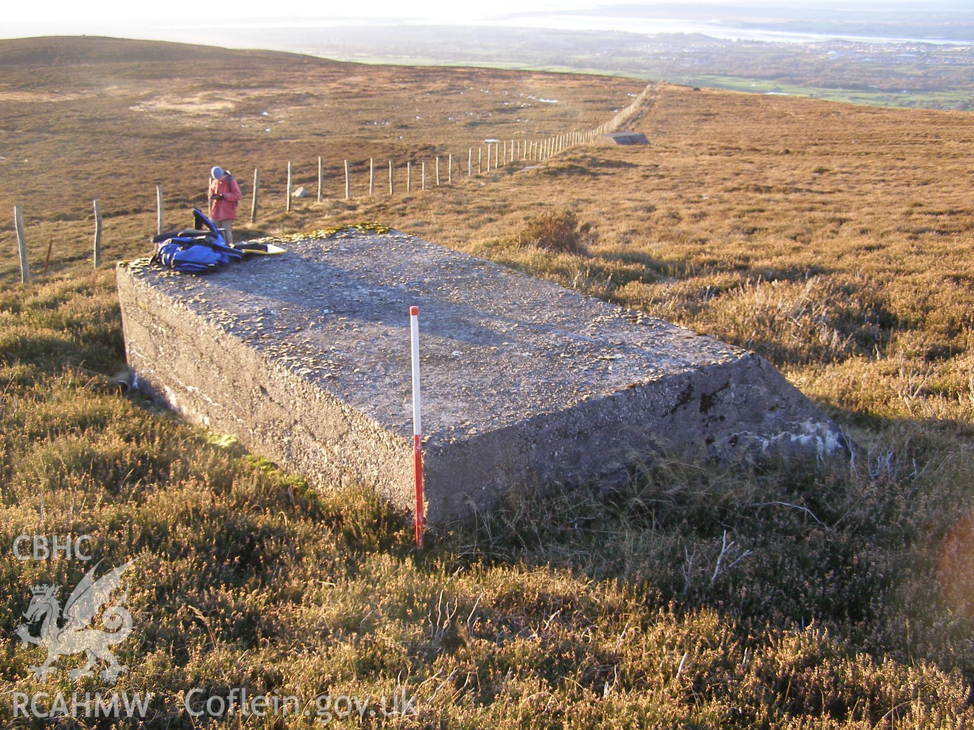 Digital colour photograph of Cefn Du Radio Station, concrete base LIX taken on 10/12/2007 by P.J. Schofield during the Snowdon North West Upland Survey undertaken by Oxford Archaeology North.