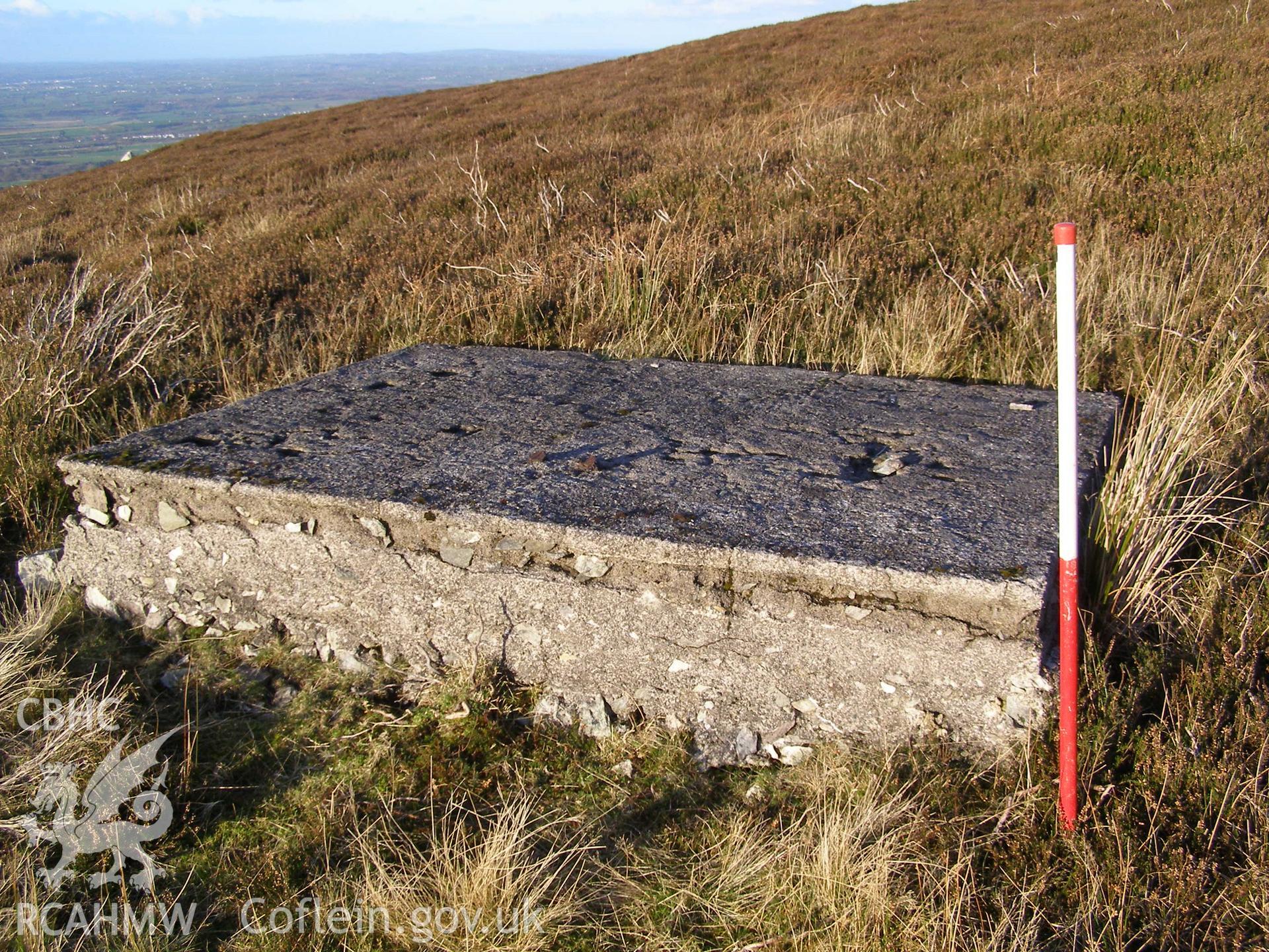 Digital colour photograph of Cefn Du Radio Station, concrete base XLIII taken on 10/12/2007 by P.J. Schofield during the Snowdon North West Upland Survey undertaken by Oxford Archaeology North.