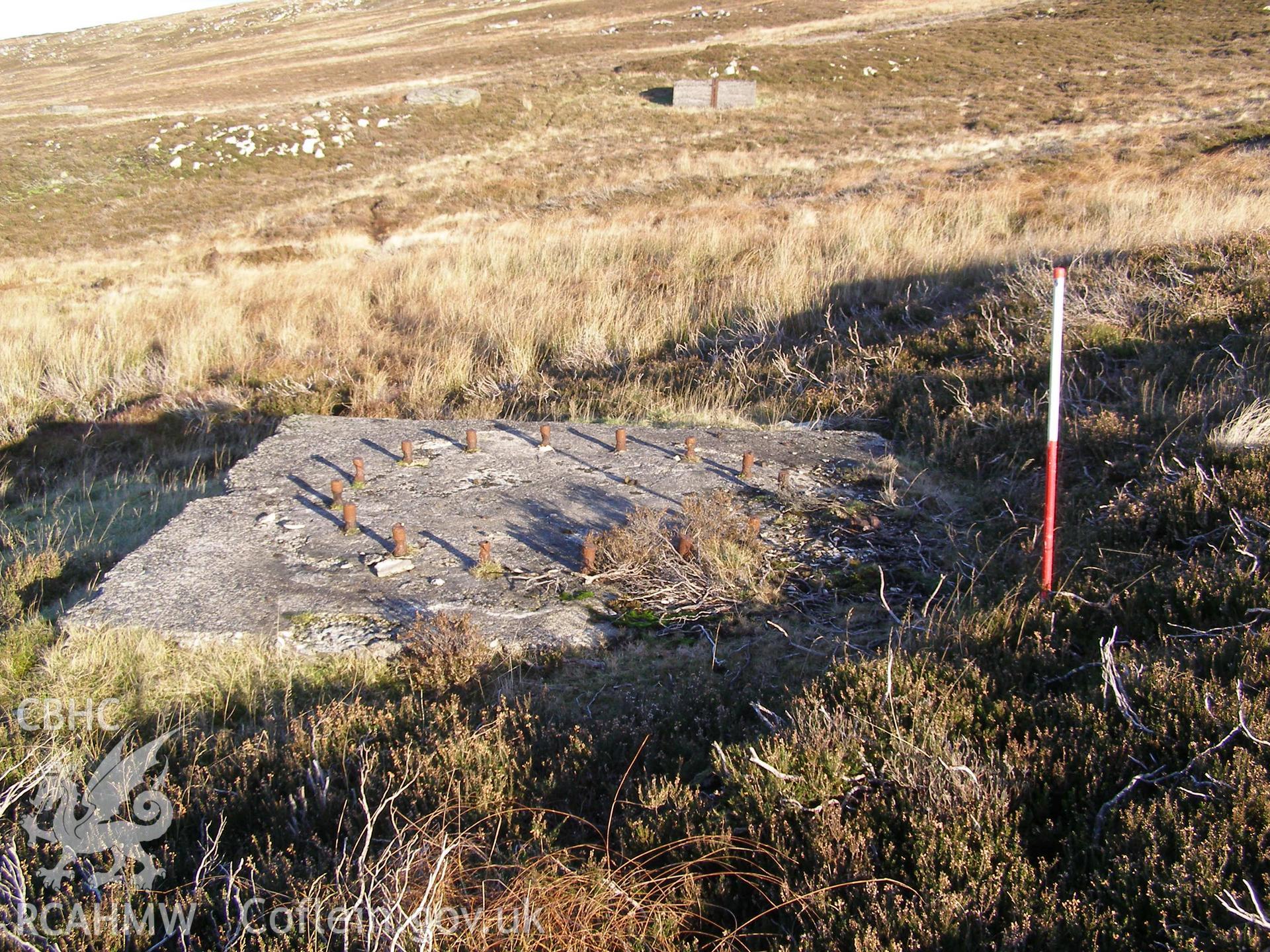 Digital colour photograph of Cefn Du Radio Station, concrete base XXXIII taken on 12/10/2007 by P.J. Schofield during the Snowdon North West Upland Survey undertaken by Oxford Archaeology North.