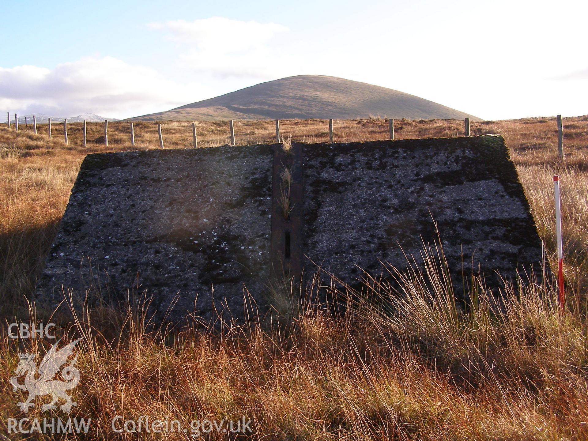 Digital colour photograph of Cefn Du Radio Station, concrete base XXXV taken on 10/12/2007 by P.J. Schofield during the Snowdon North West Upland Survey undertaken by Oxford Archaeology North.