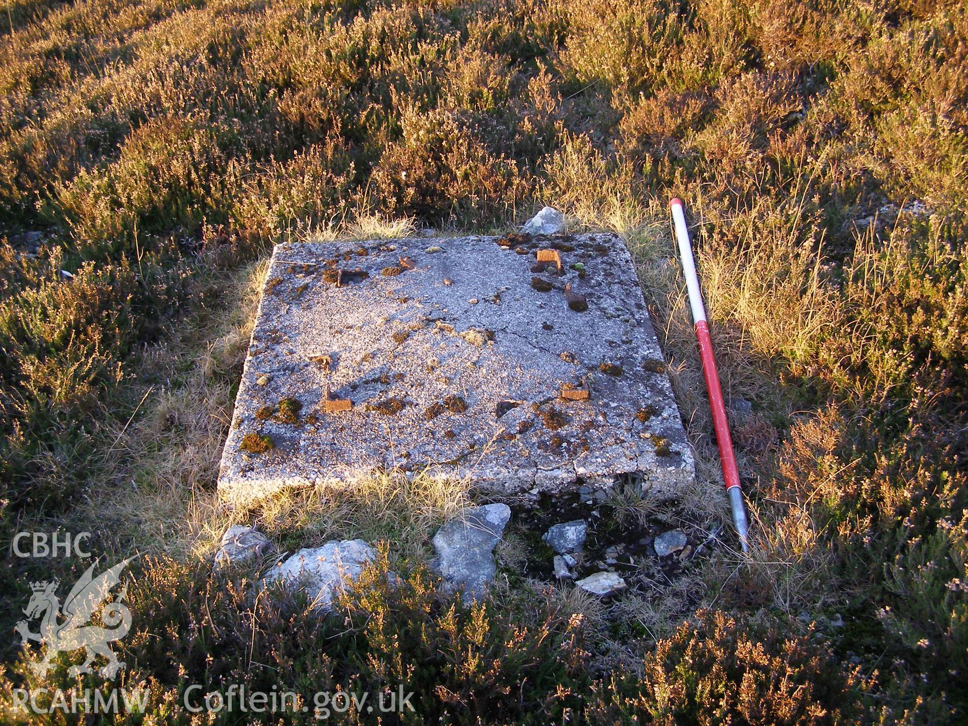 Digital colour photograph of Cefn Du Radio Station, concrete base LX taken on 10/12/2007 by P.J. Schofield during the Snowdon North West Upland Survey undertaken by Oxford Archaeology North.