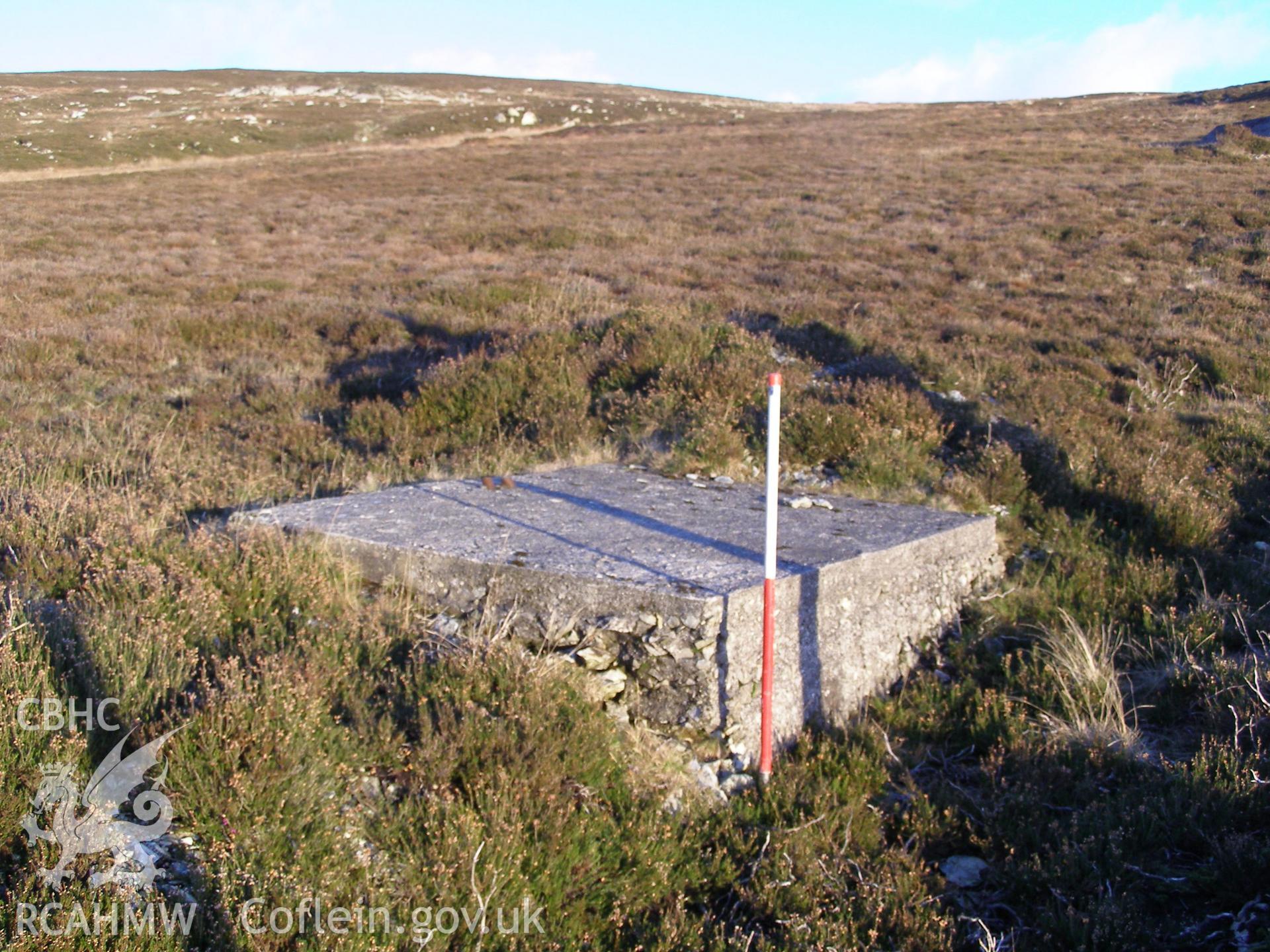Digital colour photograph of Cefn Du Radio Station, concrete base LVIII taken on 10/12/2007 by P.J. Schofield during the Snowdon North West Upland Survey undertaken by Oxford Archaeology North.