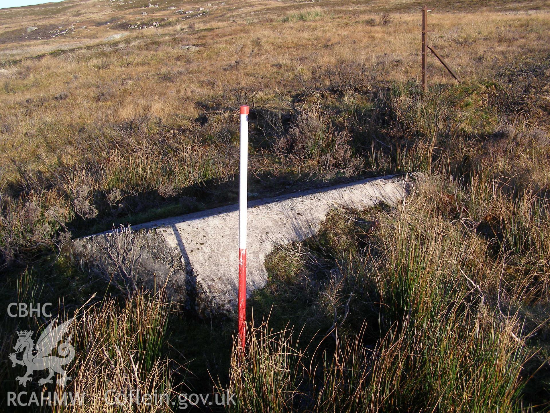 Digital colour photograph of Cefn Du Radio Station, concrete base XL taken on 10/12/2007 by P.J. Schofield during the Snowdon North West Upland Survey undertaken by Oxford Archaeology North.