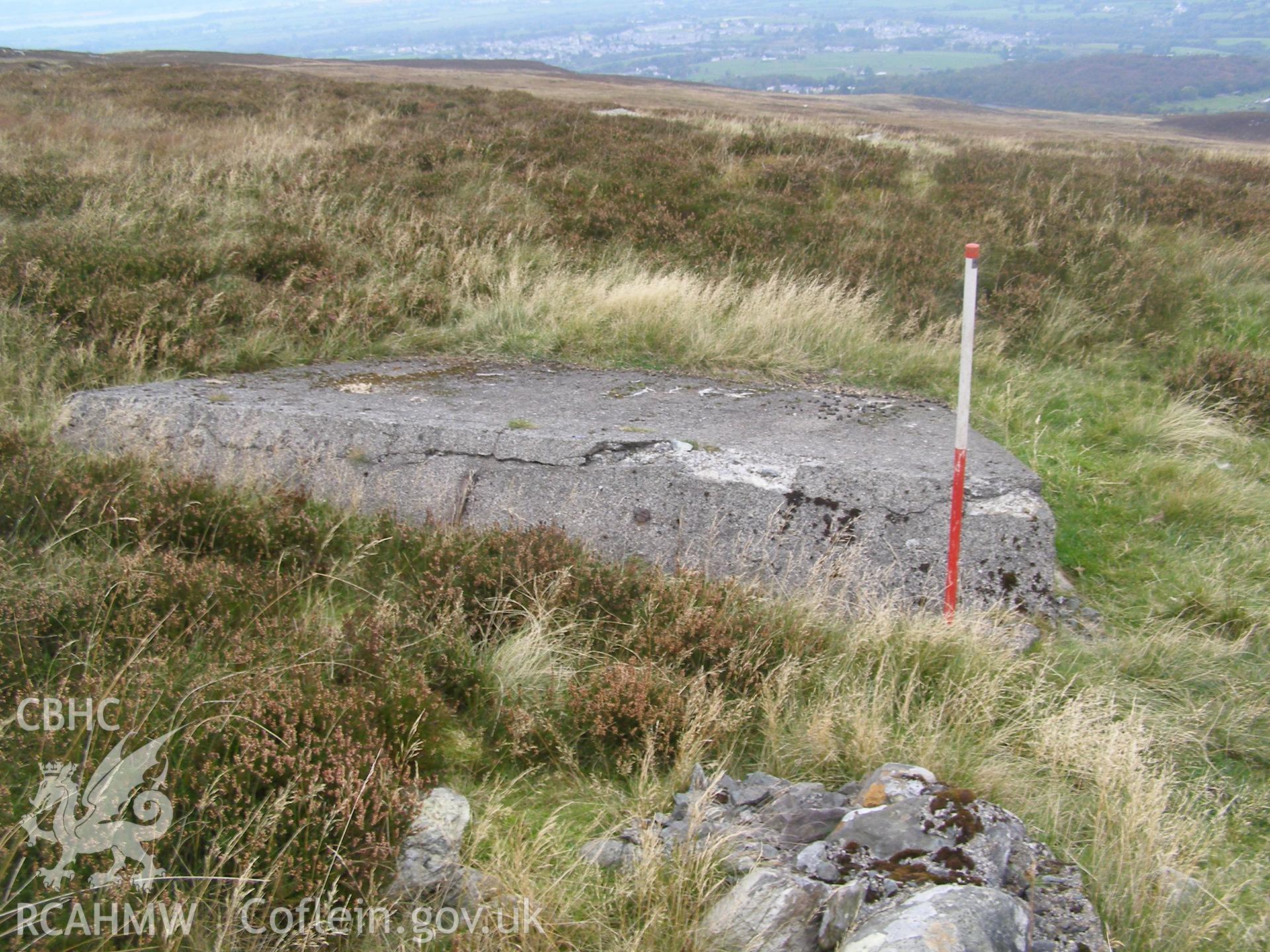 Digital colour photograph of Cefn Du Radio Station, concrete base XI taken on 08/10/2007 by P.J. Schofield during the Snowdon North West Upland Survey undertaken by Oxford Archaeology North.