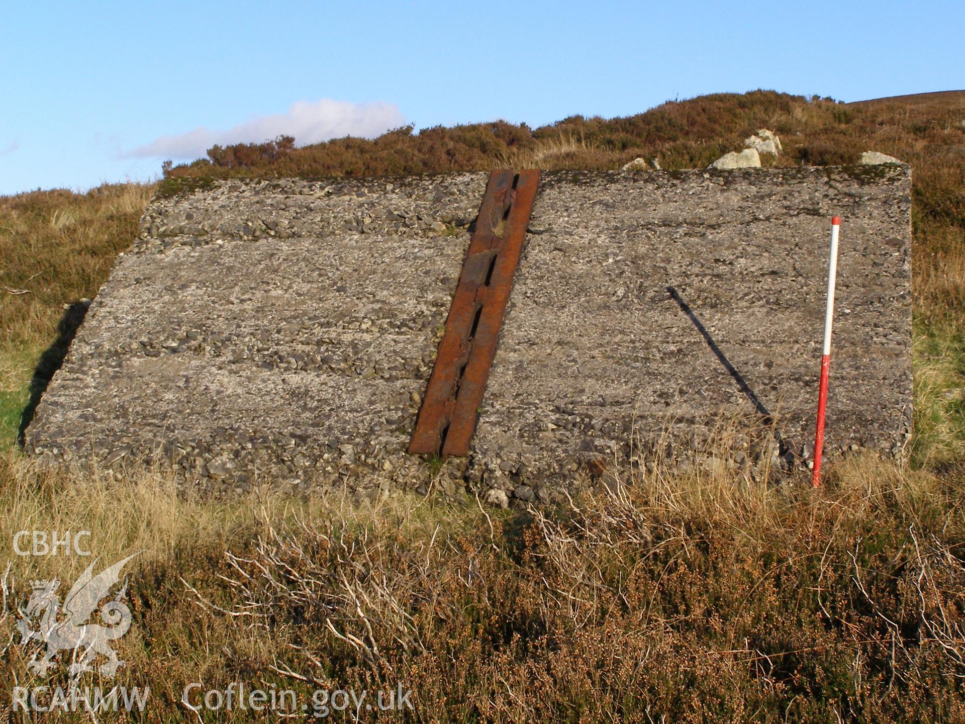 Digital colour photograph of Cefn Du Radio Station, concrete base XXXVI taken on 10/12/2007 by P.J. Schofield during the Snowdon North West Upland Survey undertaken by Oxford Archaeology North.
