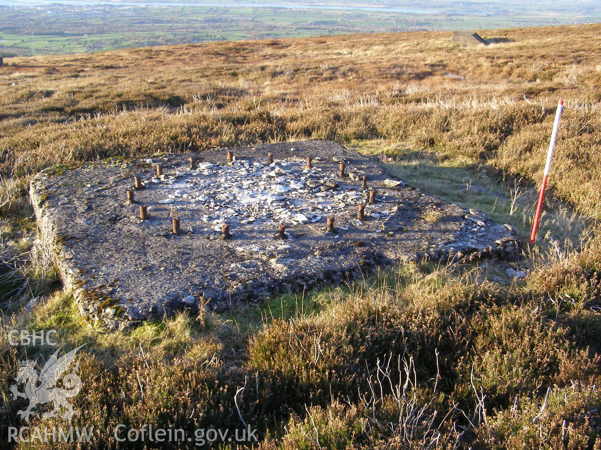 Digital colour photograph of Cefn Du Radio Station, concrete base XLV taken on 10/12/2007 by P.J. Schofield during the Snowdon North West Upland Survey undertaken by Oxford Archaeology North.