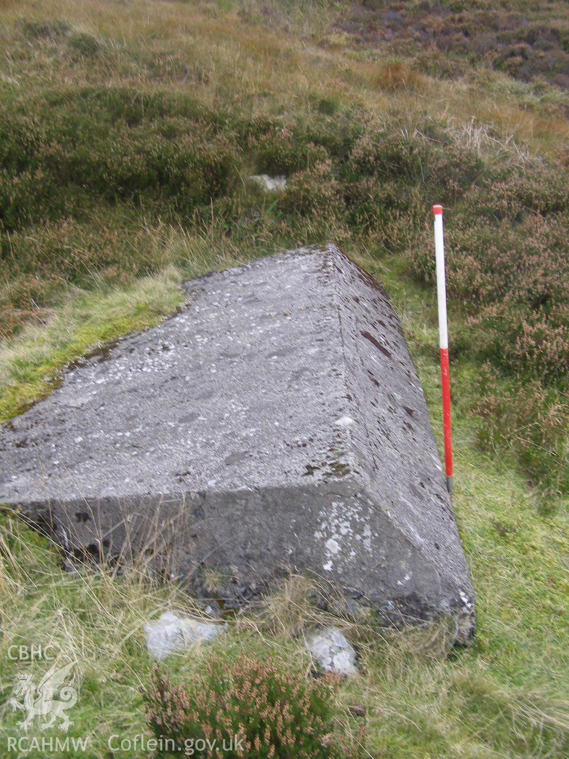 Digital colour photograph of Cefn Du Radio Station, concrete base XI taken on 08/10/2007 by P.J. Schofield during the Snowdon North West Upland Survey undertaken by Oxford Archaeology North.