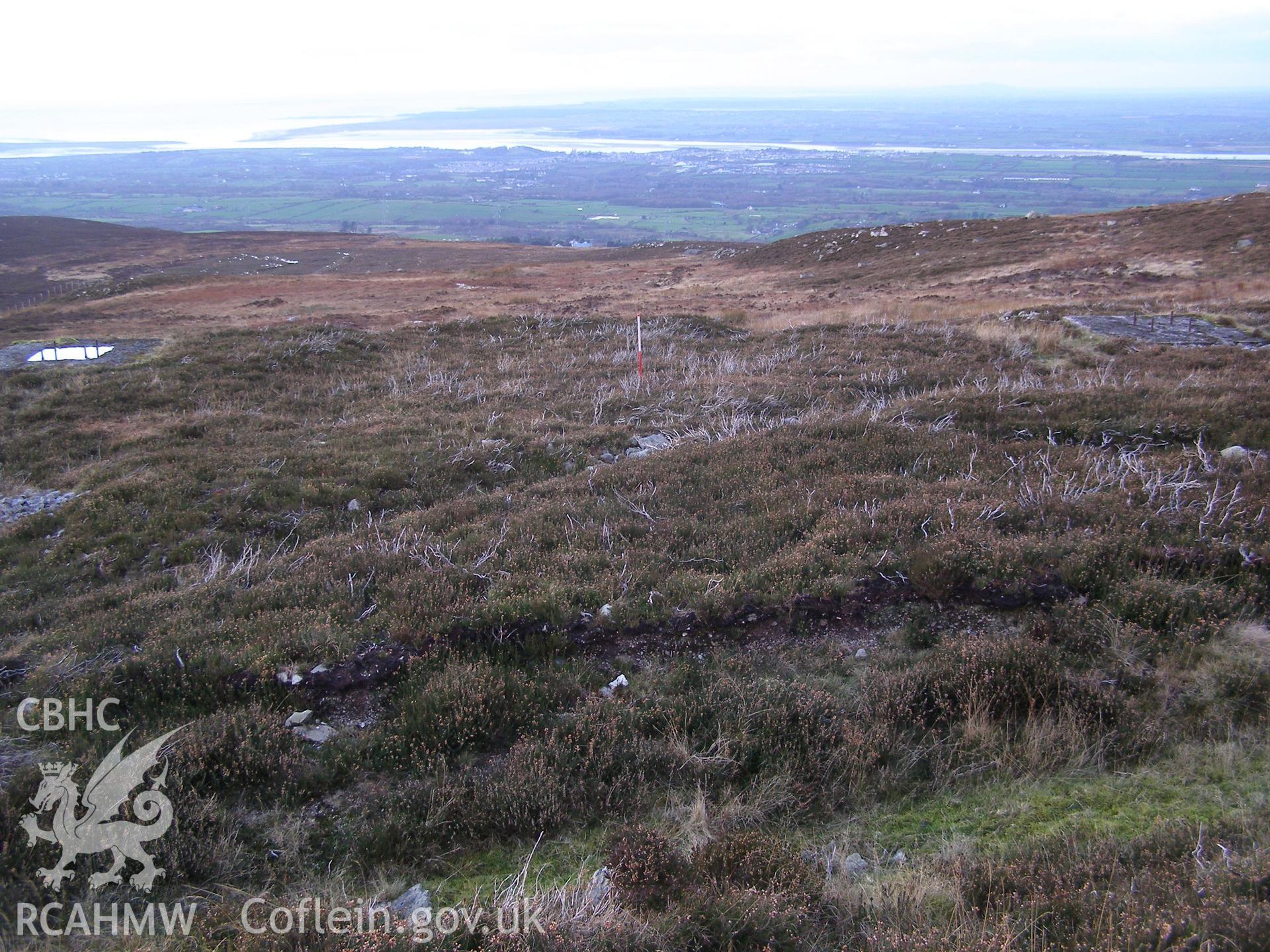 Digital colour photograph of Cefn Du Radio Station, concrete base LXI taken on 10/12/2007 by P.J. Schofield during the Snowdon North West Upland Survey undertaken by Oxford Archaeology North.