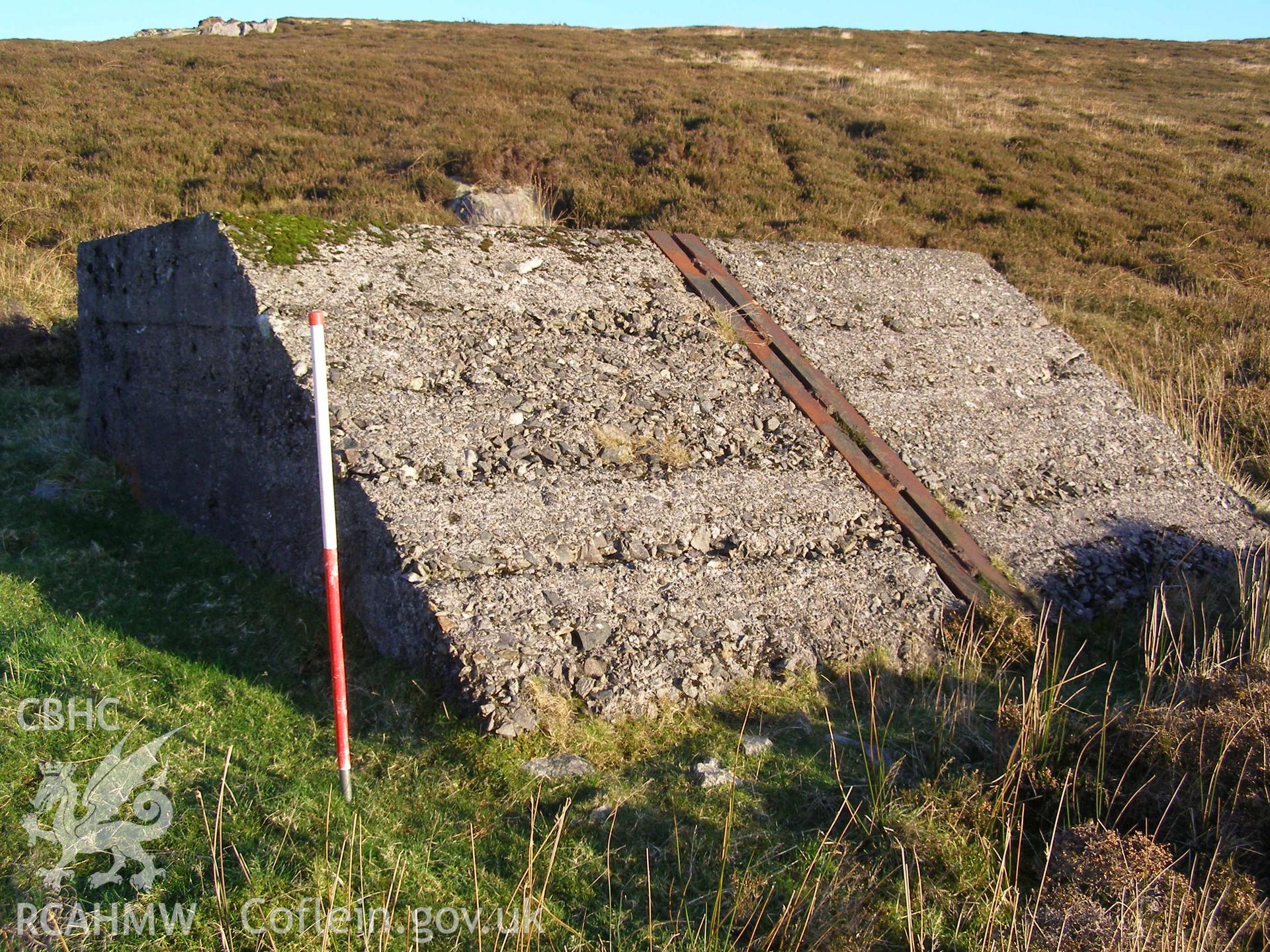 Digital colour photograph of Cefn Du Radio Station, concrete base XLIV taken on 10/12/2007 by P.J. Schofield during the Snowdon North West Upland Survey undertaken by Oxford Archaeology North.