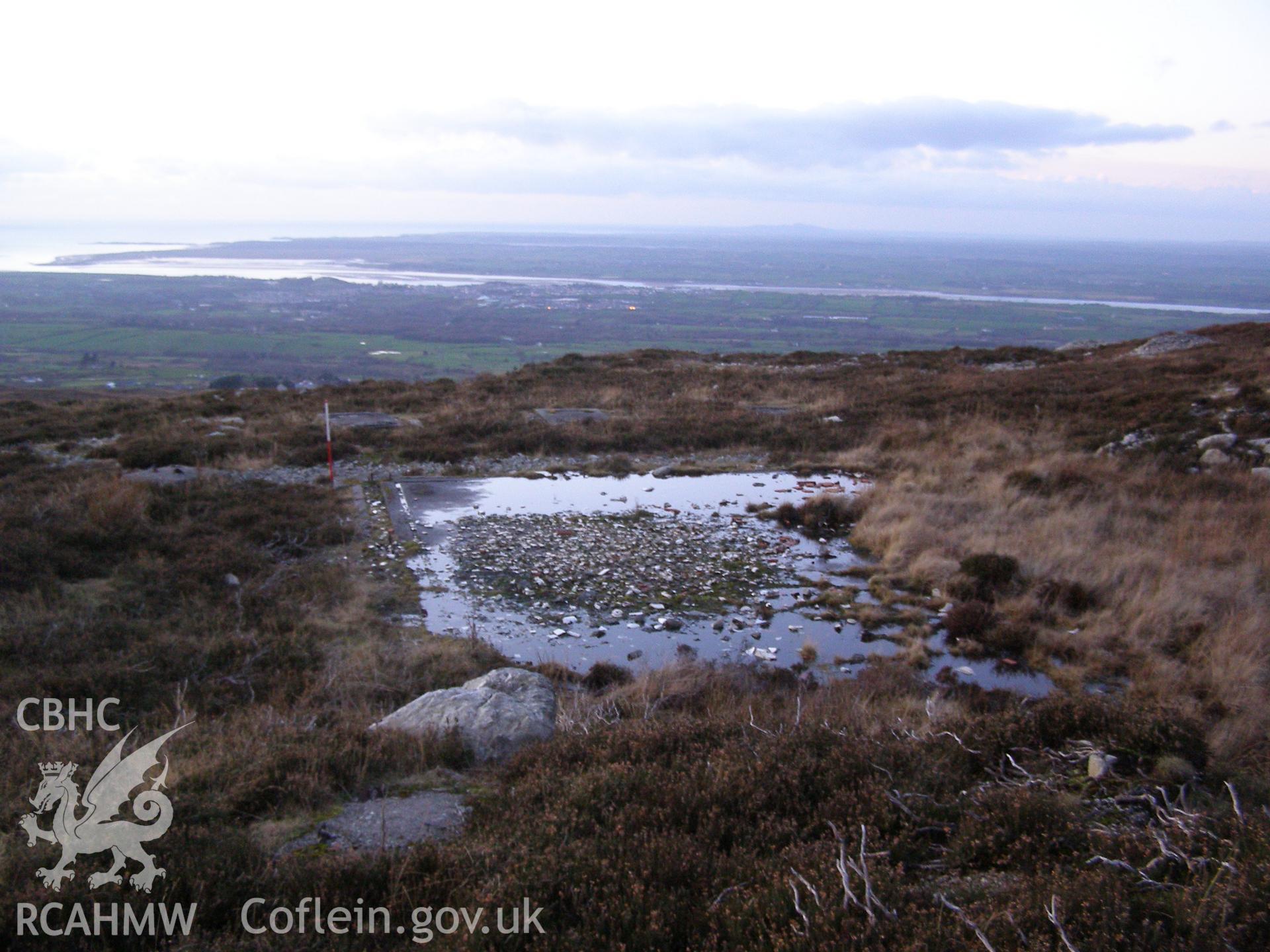 Digital colour photograph of Cefn Du Radio Station, concrete base LXIII taken on 10/12/2007 by P.J. Schofield during the Snowdon North West Upland Survey undertaken by Oxford Archaeology North.