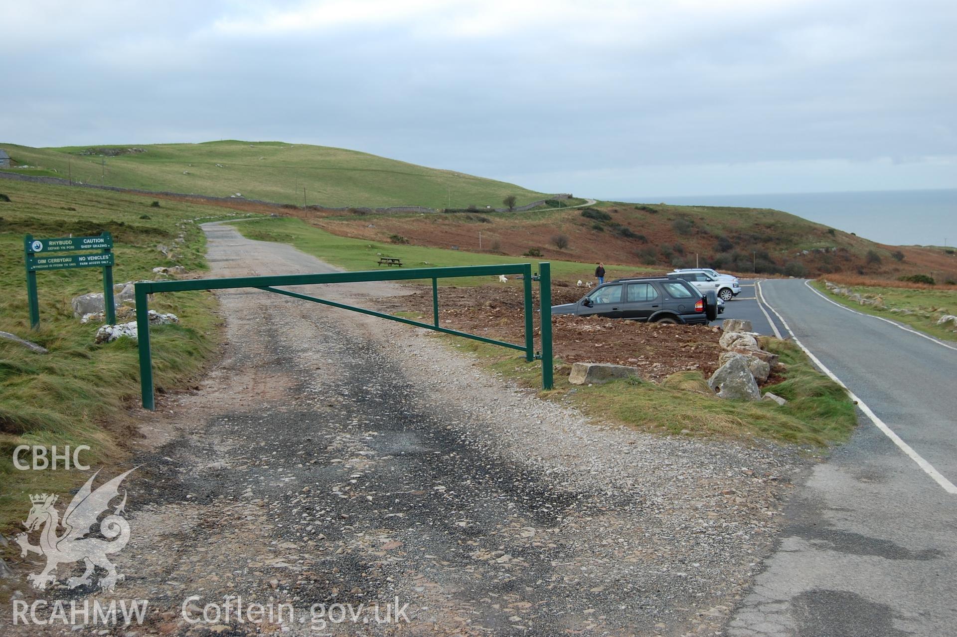 Digital photograph of the finished carpark from the SE end, showing the gate.